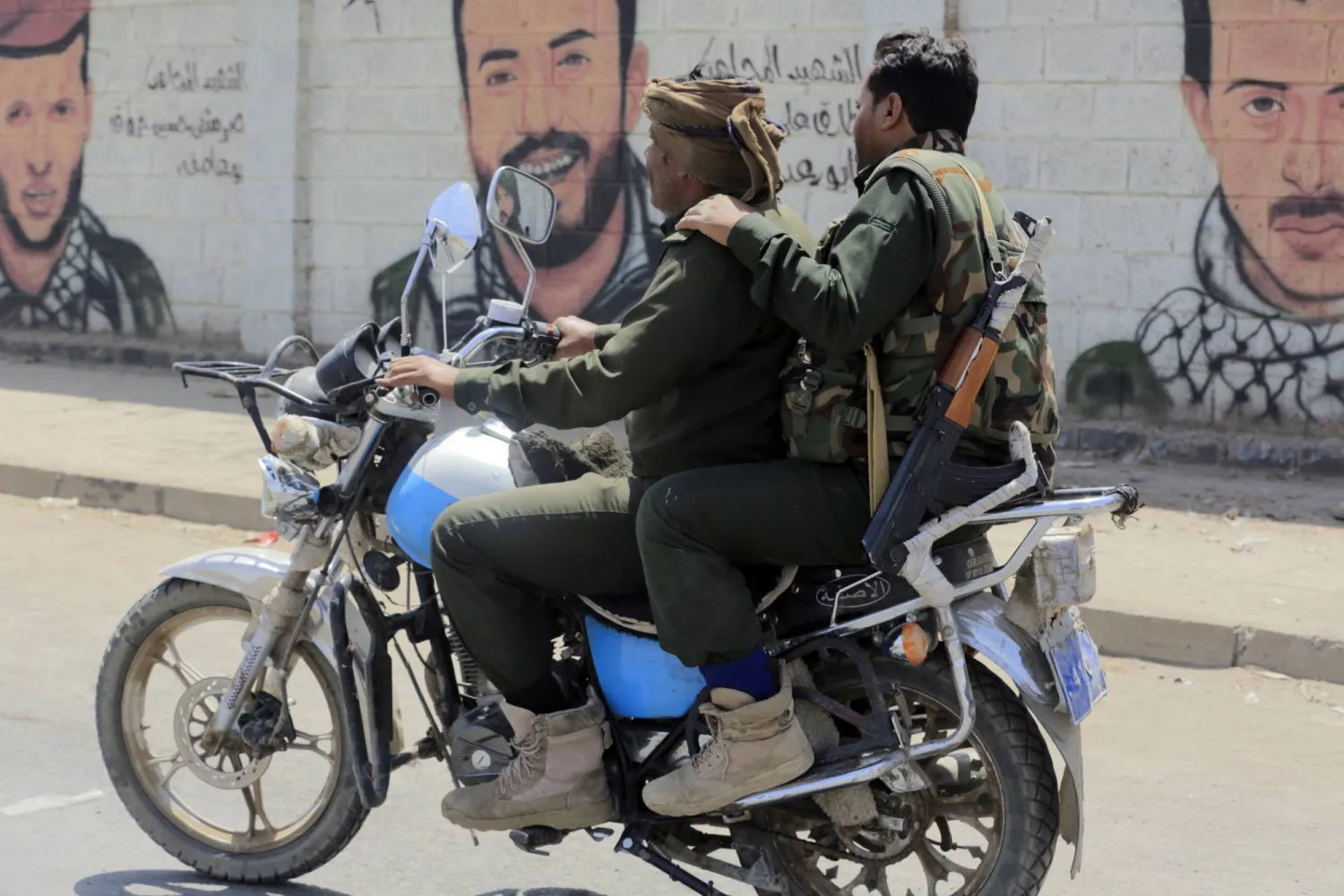 Houthi militiamen ride a motorcycle in Sanaa, Yemen, 24 June 2024. EPA/YAHYA ARHAB
