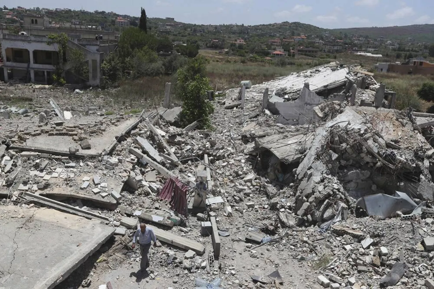  A man inspects a destroyed house that was hit by an Israeli airstrike, in Aita al-Shaab village, south Lebanon, Saturday, June 29, 2024. (AP)