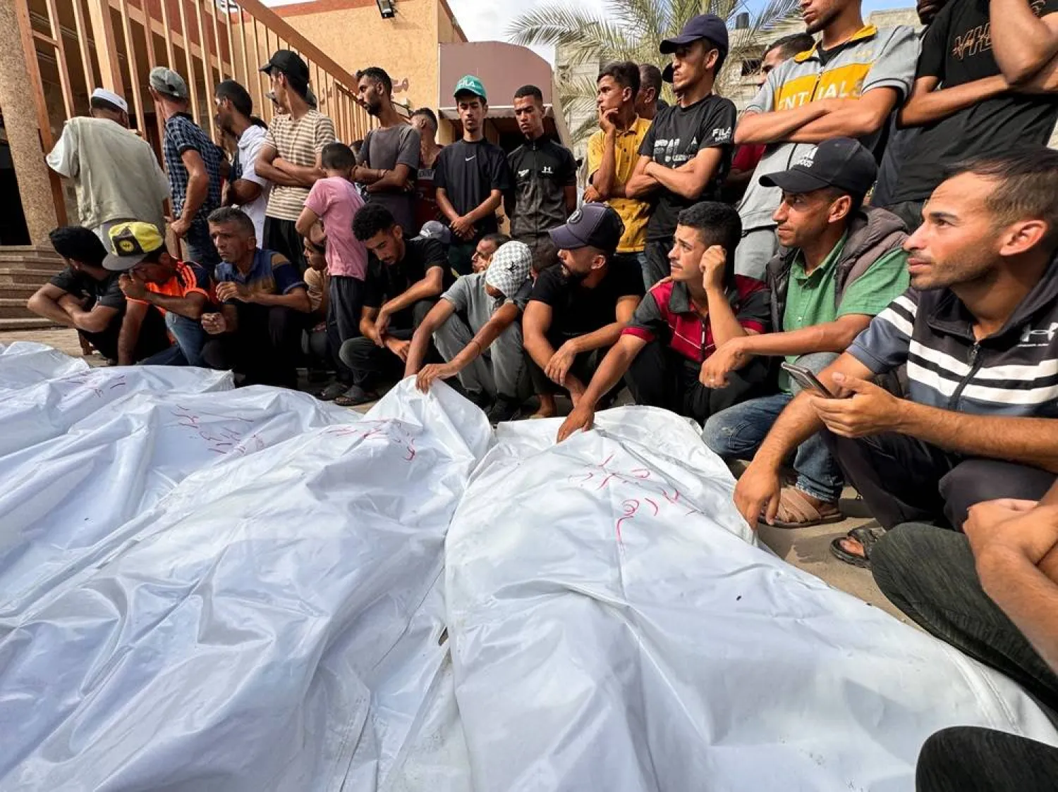  Mourners react next to the bodies of Palestinians from Zurob family who were killed in an Israeli strike, at Nasser hospital in Khan Younis, in the southern Gaza Strip, June 30, 2024. (Reuters)