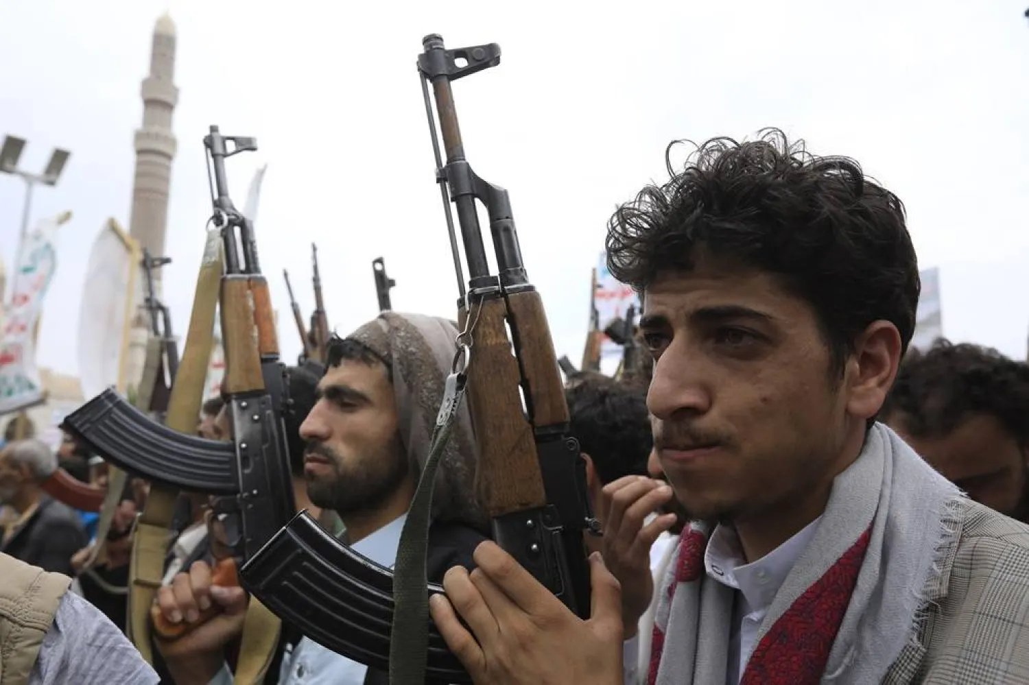 Houthi supporters brandish weapons during a protest against the US and Israel, and in solidarity with the Palestinian people, in Sanaa, Yemen, 28 June 2024. (EPA)