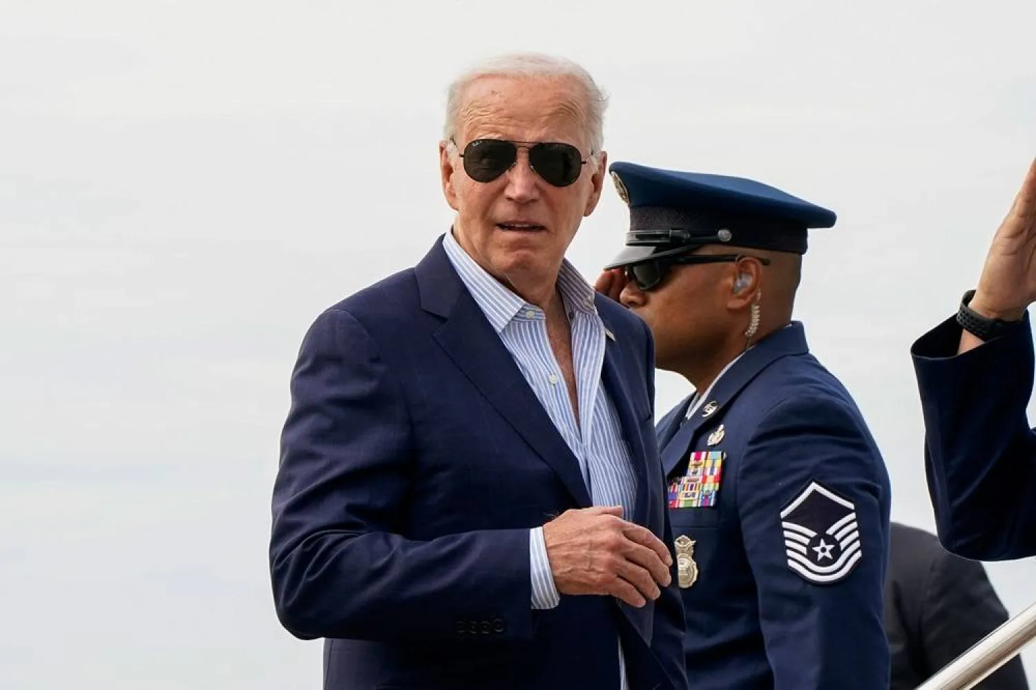 US President Joe Biden looks back before boarding Air Force One at Francis S. Gabreski Airport in Westhampton Beach, New York, US, June 29, 2024. (Reuters)