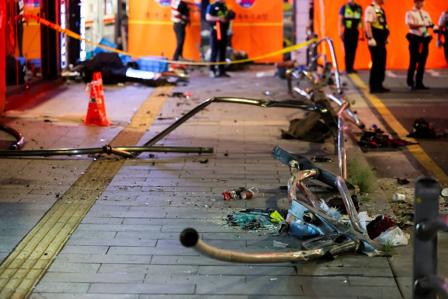 Broken glass and debris lie at the scene of car accident that resulted in several people killed and injured in central Seoul, South Korea July 1, 2024. REUTERS/Kim Hong-Ji