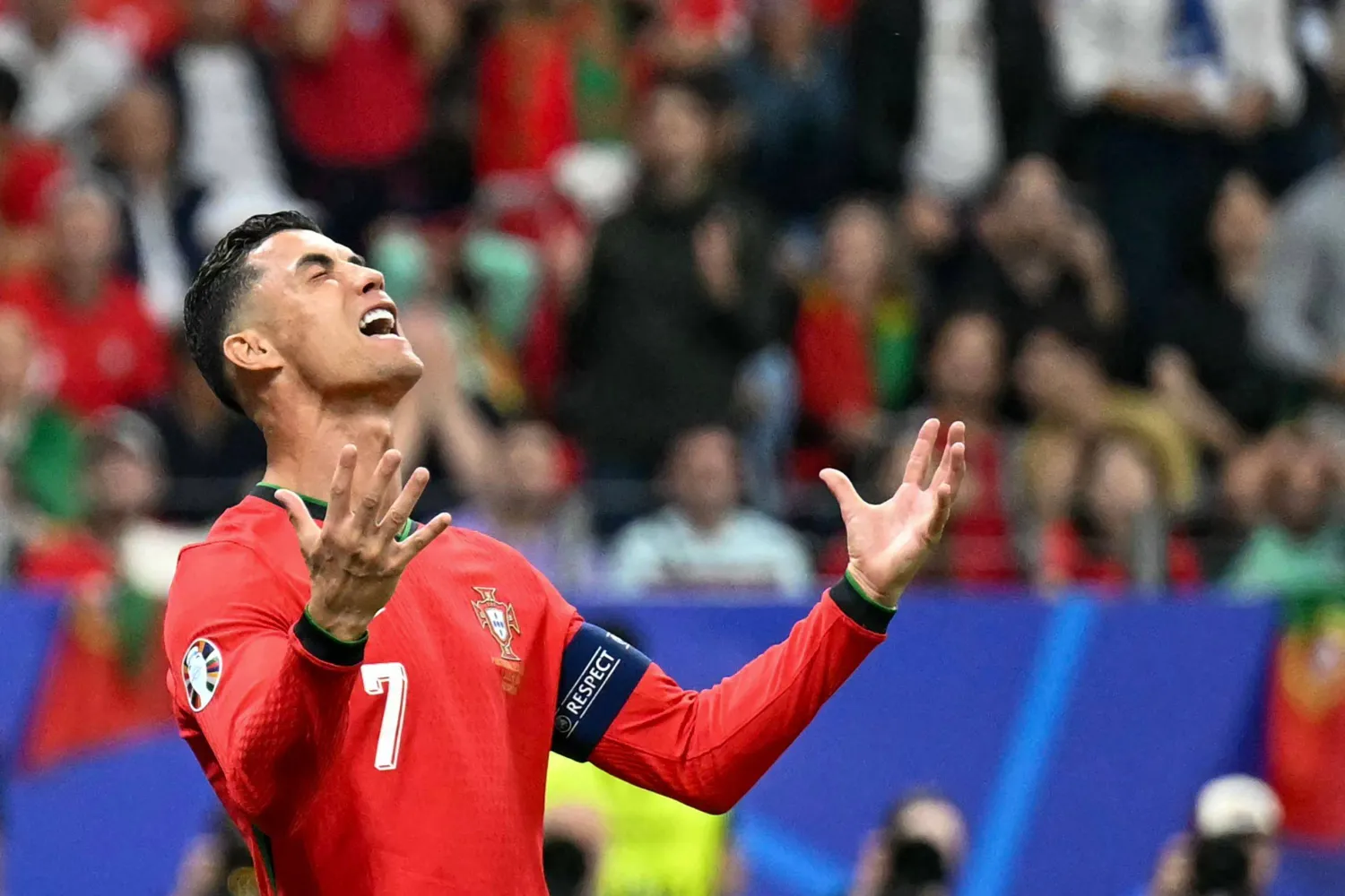 Portugal's forward #07 Cristiano Ronaldo reacts  during the UEFA Euro 2024 round of 16 football match between Portugal and Slovenia at the Frankfurt Arena in Frankfurt am Main on July 1, 2024. (Photo by PATRICIA DE MELO MOREIRA / AFP)