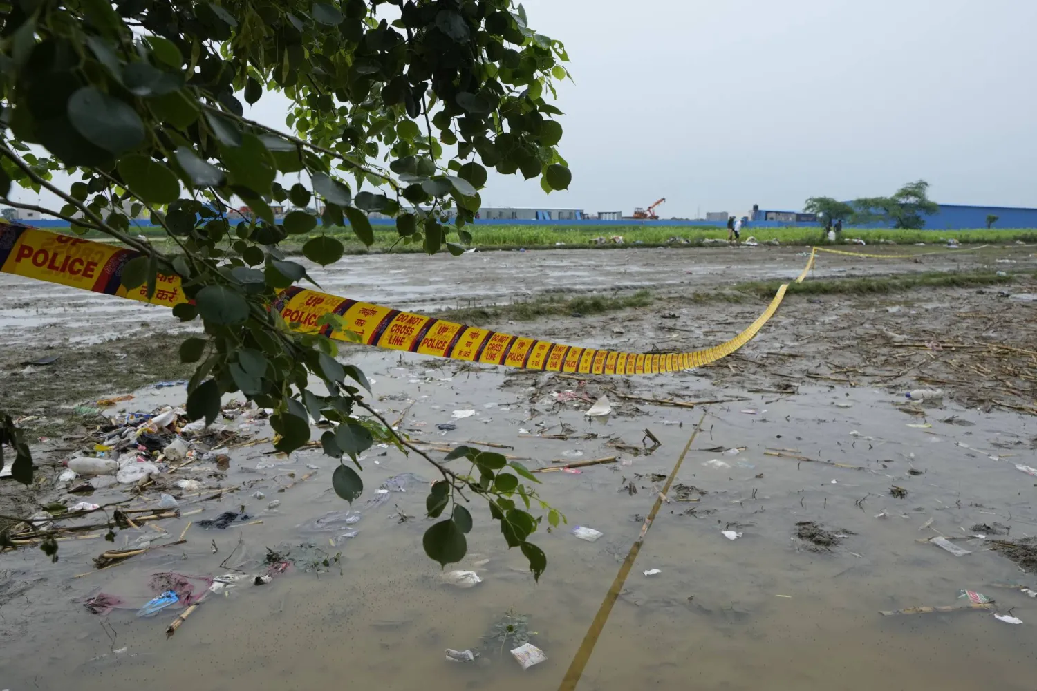 Police tape cordons off the scene a day after a fatal stampede, in Fulrai village of Hathras district, India, Wednesday, July 3, 2024. (AP Photo/Rajesh Kumar Singh)