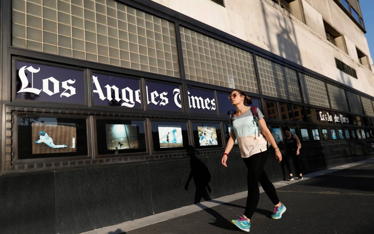 People walk by the Los Angeles Times building in Los Angeles, California, US, February 6, 2018. REUTERS/Mario Anzuoni Purchase Licensing Rights