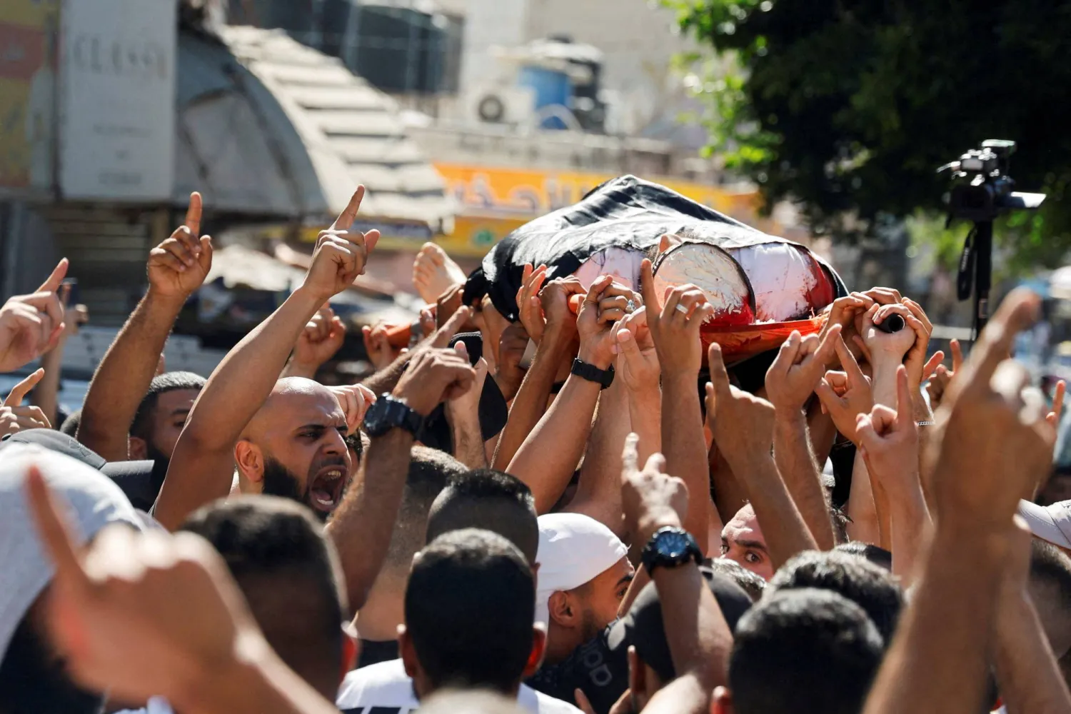 Mourners carry the body of a Palestinian who was killed by Israeli forces, during his funeral in Jenin camp in the Israeli-occupied West Bank. July 3, 2024. REUTERS /Raneen Sawafta 