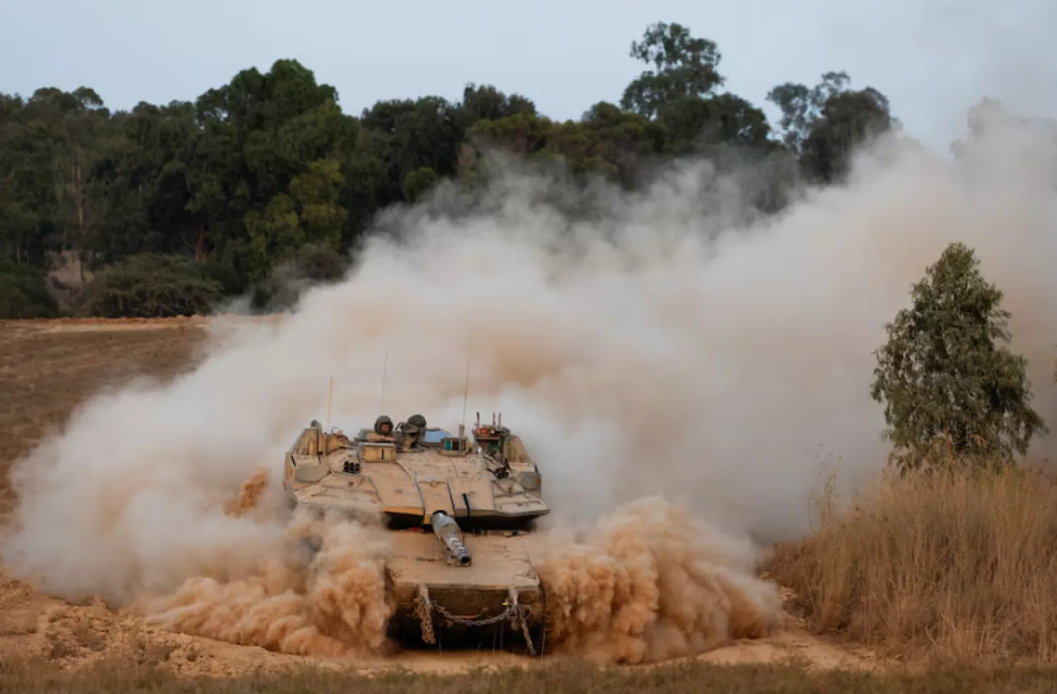 An Israeli tank maneuvers near the Israel-Gaza border before it enters Gaza, amid the Israel-Hamas conflict, as seen from Israel, July 4, 2024. REUTERS/Amir Cohen/File Photo Purchase Licensing Rights