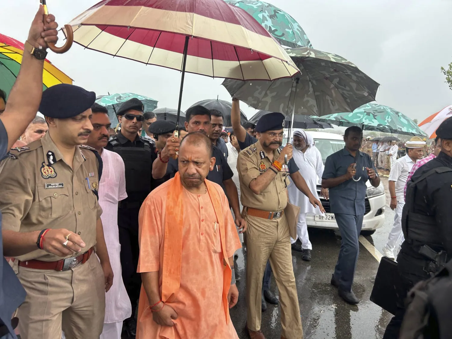 Uttar Pradesh State Chief Minister Yogi Adityanath visits the place where a fatal stampede took place in Fulrai village of Hathras district, Uttar Pradesh, India, Wednesday, July 3, 2024. (AP Photo/Rajesh Kumar Singh)