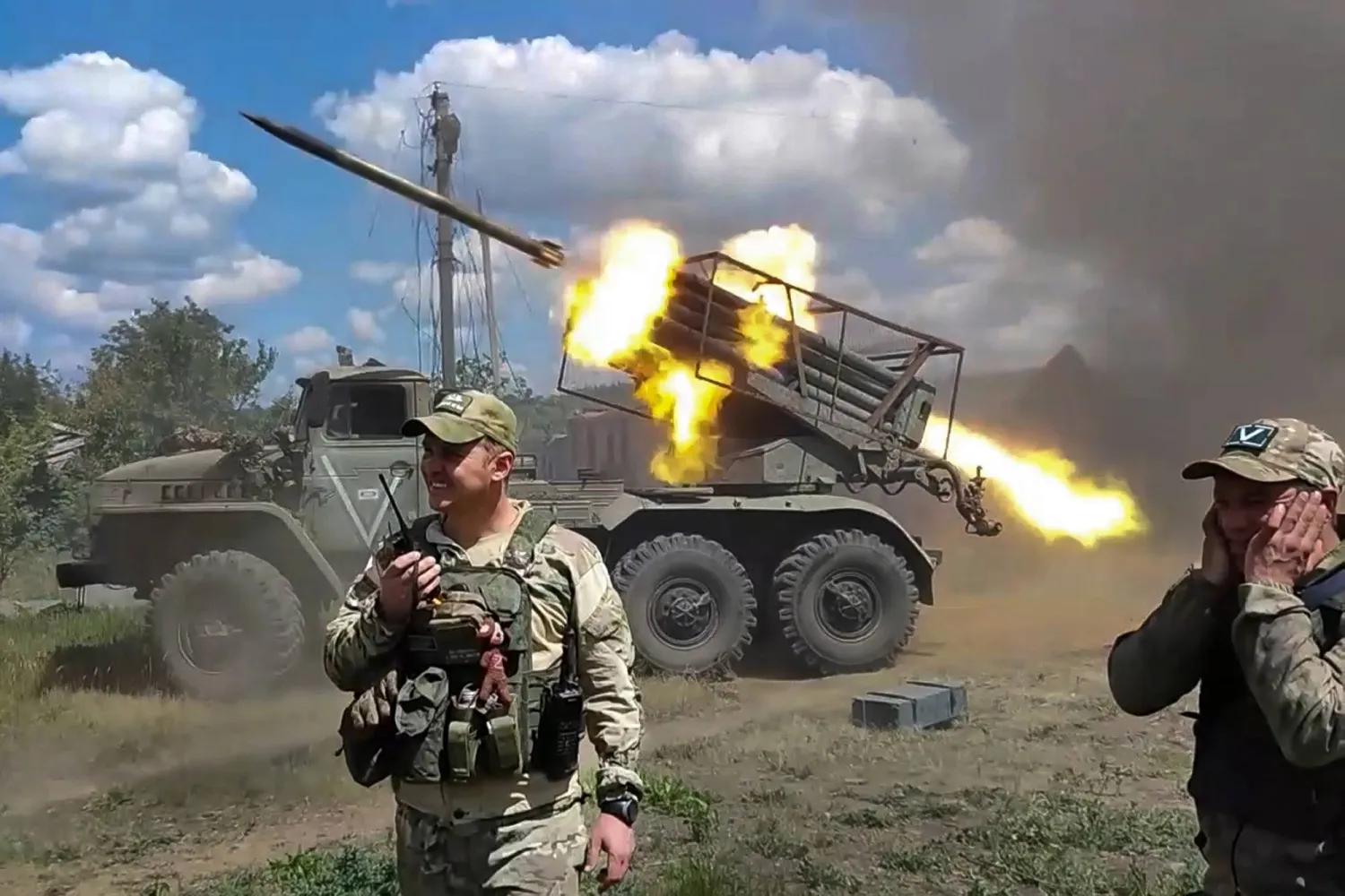 FILE - In this photo taken from video released by the Russian Defense Ministry on Monday, July 1, 2024, Russian soldiers fire from the BM-21 "Grad" self-propelled 122mm multiple rocket launcher in an undisclosed location in Ukraine. (Russian Defense Ministry Press Service via AP, File)