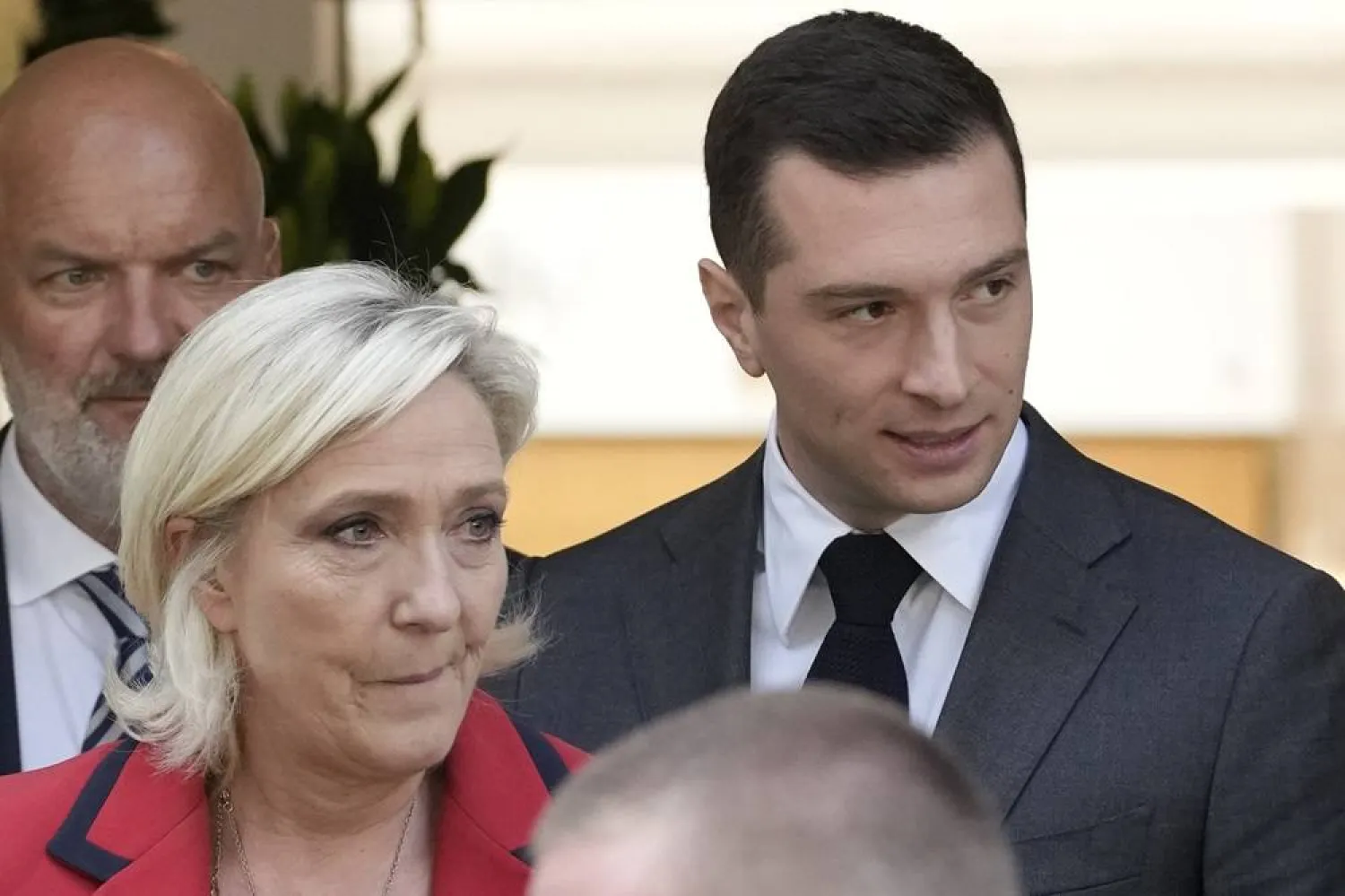 Far-right National Rally party president Jordan Bardella, right, leaves with far-right leader Marine Le Pen after a press conference, Monday, June 24, 2024 in Paris. (AP)