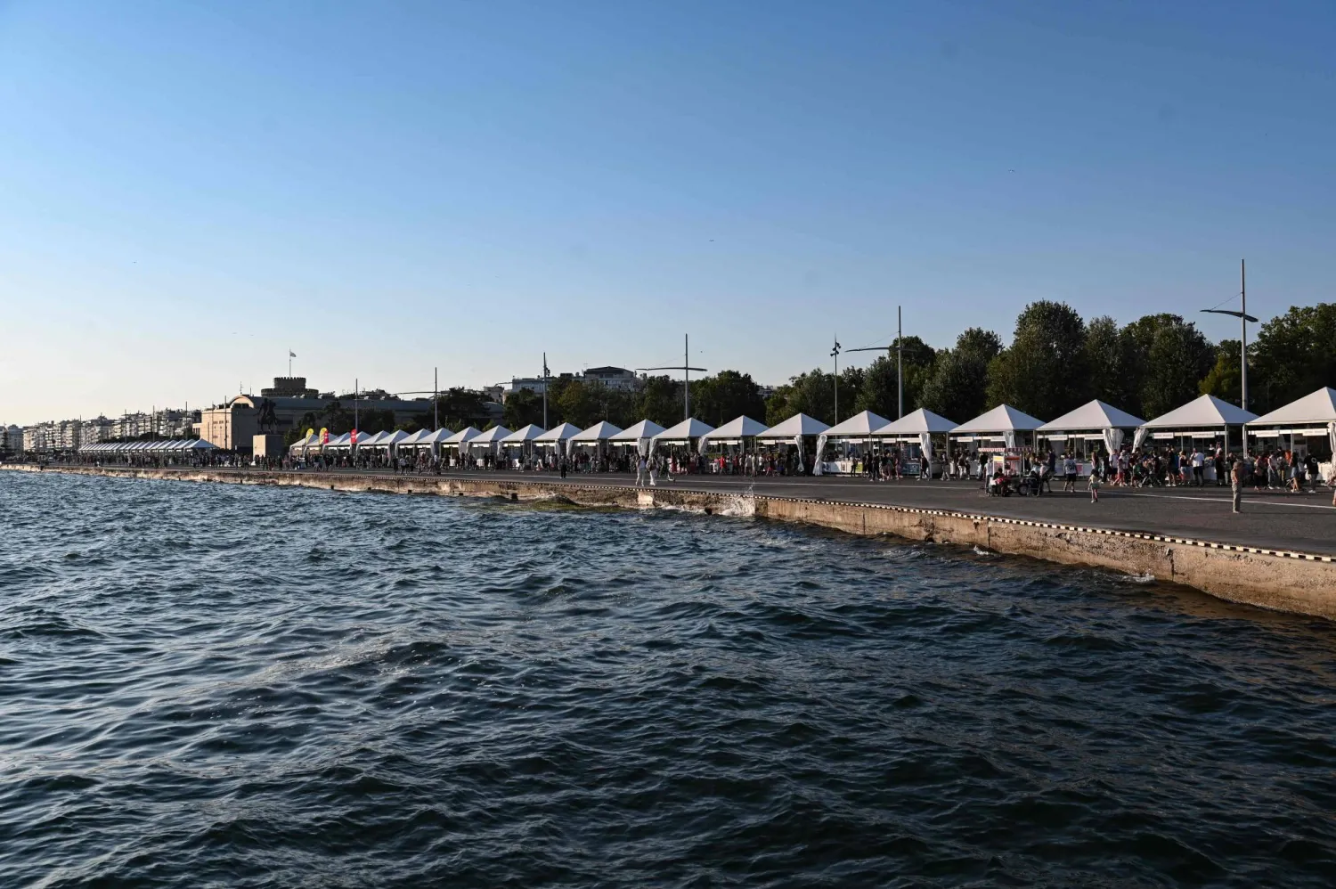 People visit the 43rd Thessaloniki Book Festival in Thessaloniki on July 7, 2024. (Photo by Sakis MITROLIDIS / AFP)