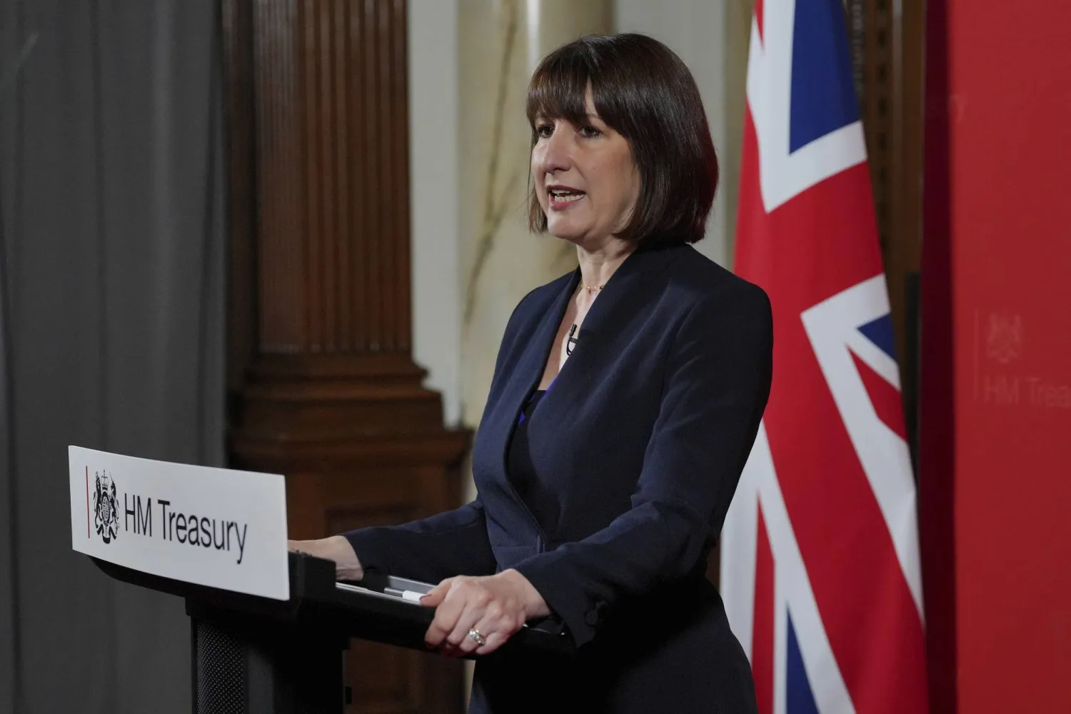 Britain's Chancellor Rachel Reeves delivers a speech at the Treasury to an audience of leading business figures and senior stakeholders, announcing the first steps the new government will be taking to deliver economic growth, in London, Monday July 8, 2024. (Jonathan Brady/Pool Photo via AP)