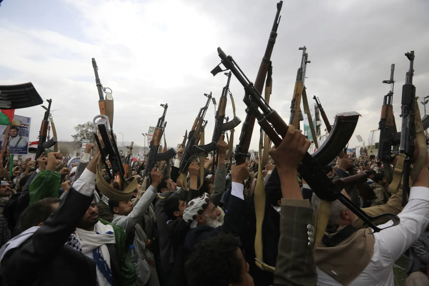 Houthi supporters chant slogans while brandishing weapons during a protest against the US and Israel, and in solidarity with the Palestinian people, in Sanaa, Yemen, 05 July 2024. EPA/YAHYA ARHAB