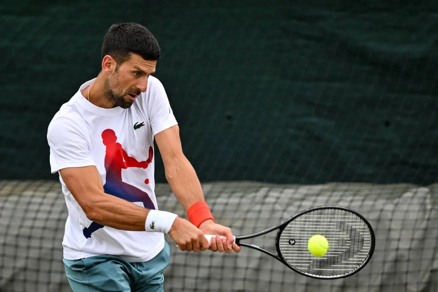 Serbia's Novak Djokovic takes part in a training session on the Aorangi practice courts on the tenth day of the 2024 Wimbledon Championships at The All England Lawn Tennis and Croquet Club in Wimbledon, southwest London, on July 10, 2024. (Photo by ANDREJ ISAKOVIC / AFP) 