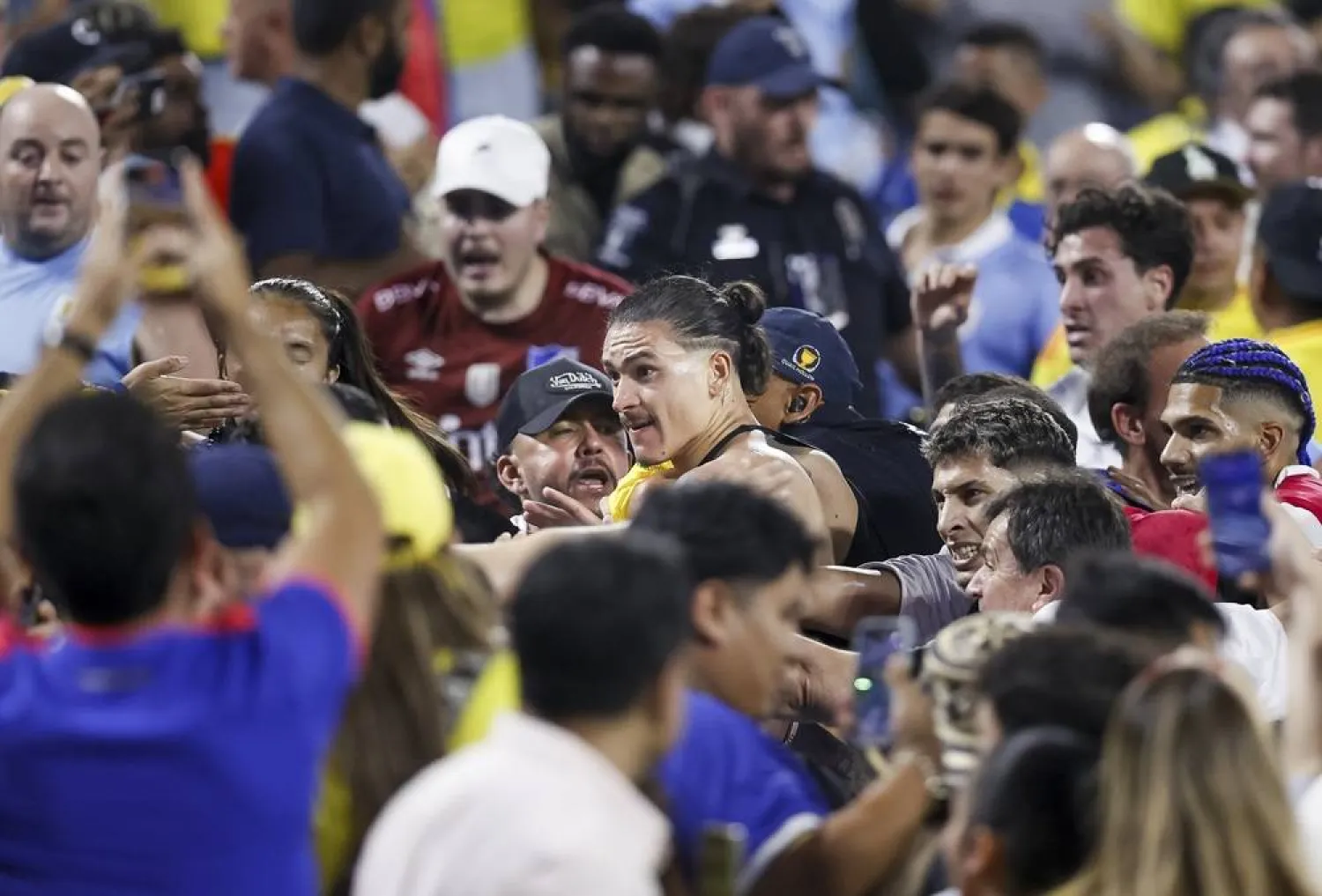 Uruguay's Darwin Nunez (C) scuffles with fans after Uruguay lost after the CONMEBOL Copa America 2024 semifinals match between Uruguay and Colombia in Charlotte, North Carolina, USA, 10 July 2024. (EPA)