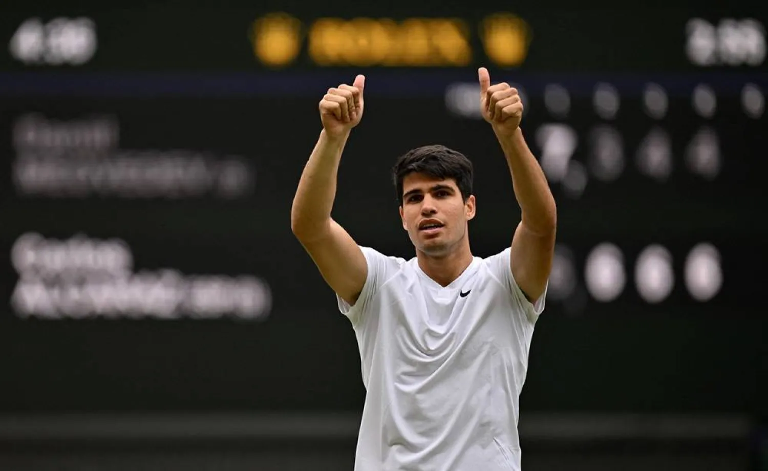 Spain's Carlos Alcaraz celebrates winning against Russia's Daniil Medvedev during their men's singles semi-final tennis match on the twelfth day of the 2024 Wimbledon Championships at The All England Lawn Tennis and Croquet Club in Wimbledon, southwest London, on July 12, 2024. (AFP)
