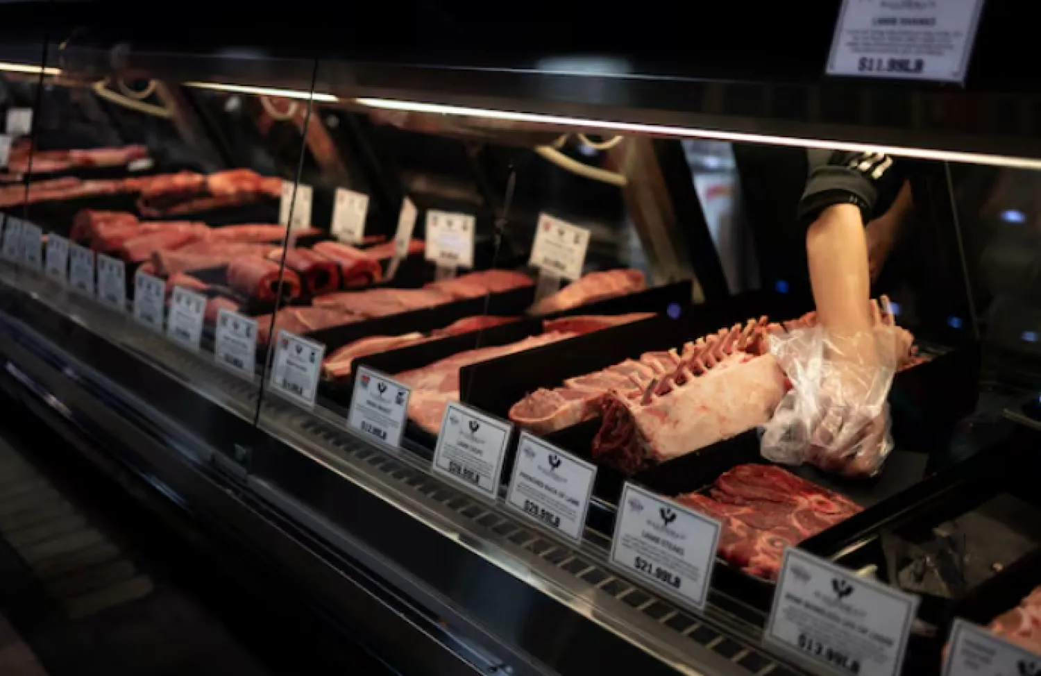 A case of meat is pictured at a butcher shop at Reading Terminal Market after the inflation rate hit a 40-year high in January, in Philadelphia, Pennsylvania, US, February 19, 2022. REUTERS/Hannah Beier/File photo Purchase Licensing Rights