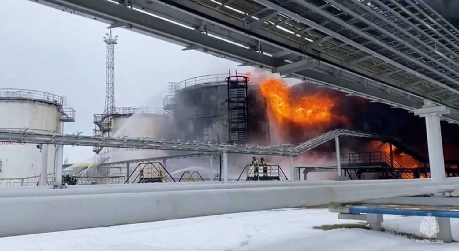 Firefighters extinguish oil tanks at a storage facility that local authorities say caught fire after the military brought down a Ukrainian drone, in the town of Klintsy in the Bryansk Region, Russia January 19, 2024, in this still image taken from video. Russian Emergencies Ministry/Handout via REUTERS/File Photo