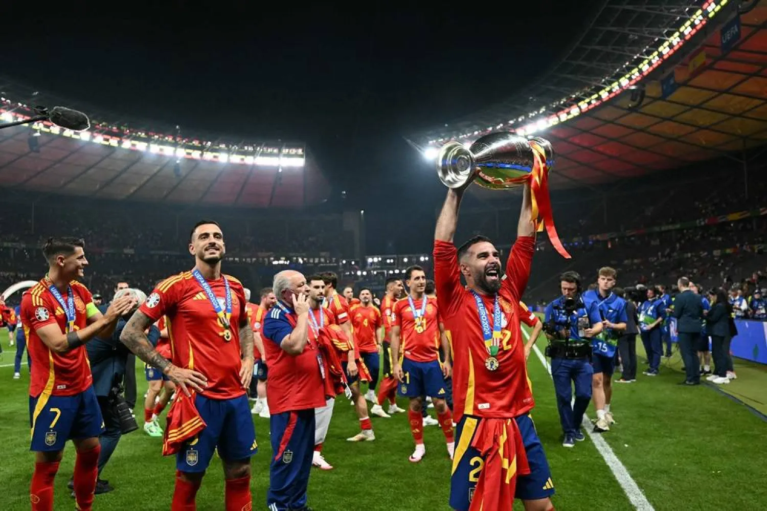  Spain's defender #02 Dani Carvajal rises the trophy during a lap of honor after winning the UEFA Euro 2024 final football match between Spain and England at the Olympiastadion in Berlin on July 14, 2024. (AFP)