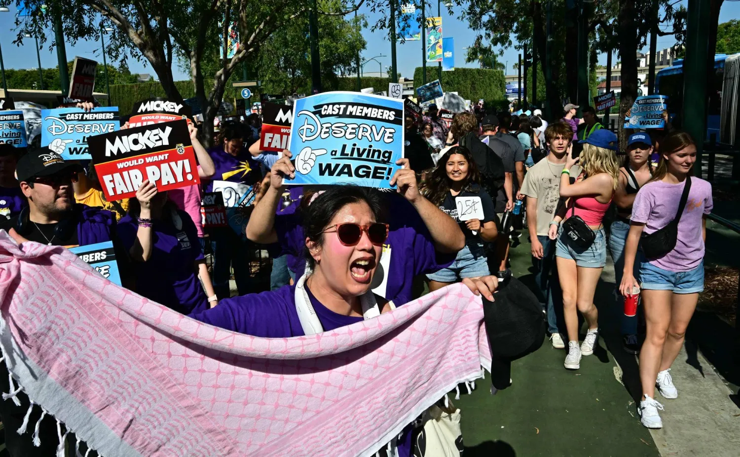 
Disney employees rally outside the main entrance of Disneyland Resort in Anaheim, California, on July 17, 2024, ahead of a planned strike authorization vote. (Photo by Frederic J. BROWN / AFP)

