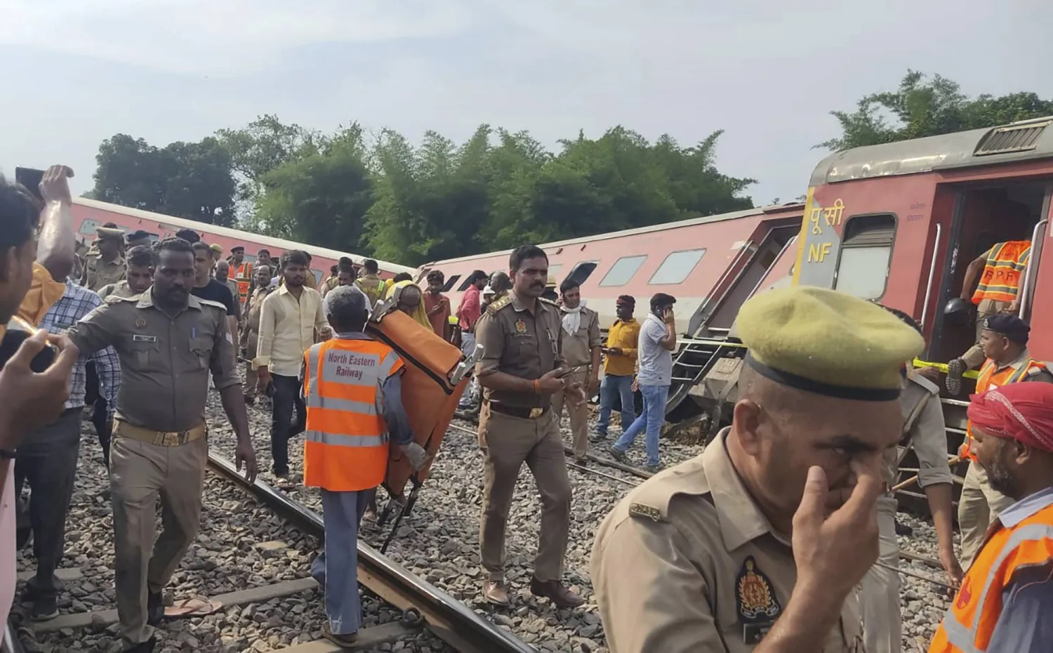 Police and rescuers arrive at the site of a passenger train accident near Gonda, 200 kilometers from Lucknow, India, Thursday, July 18, 2024. (AP Photo)
