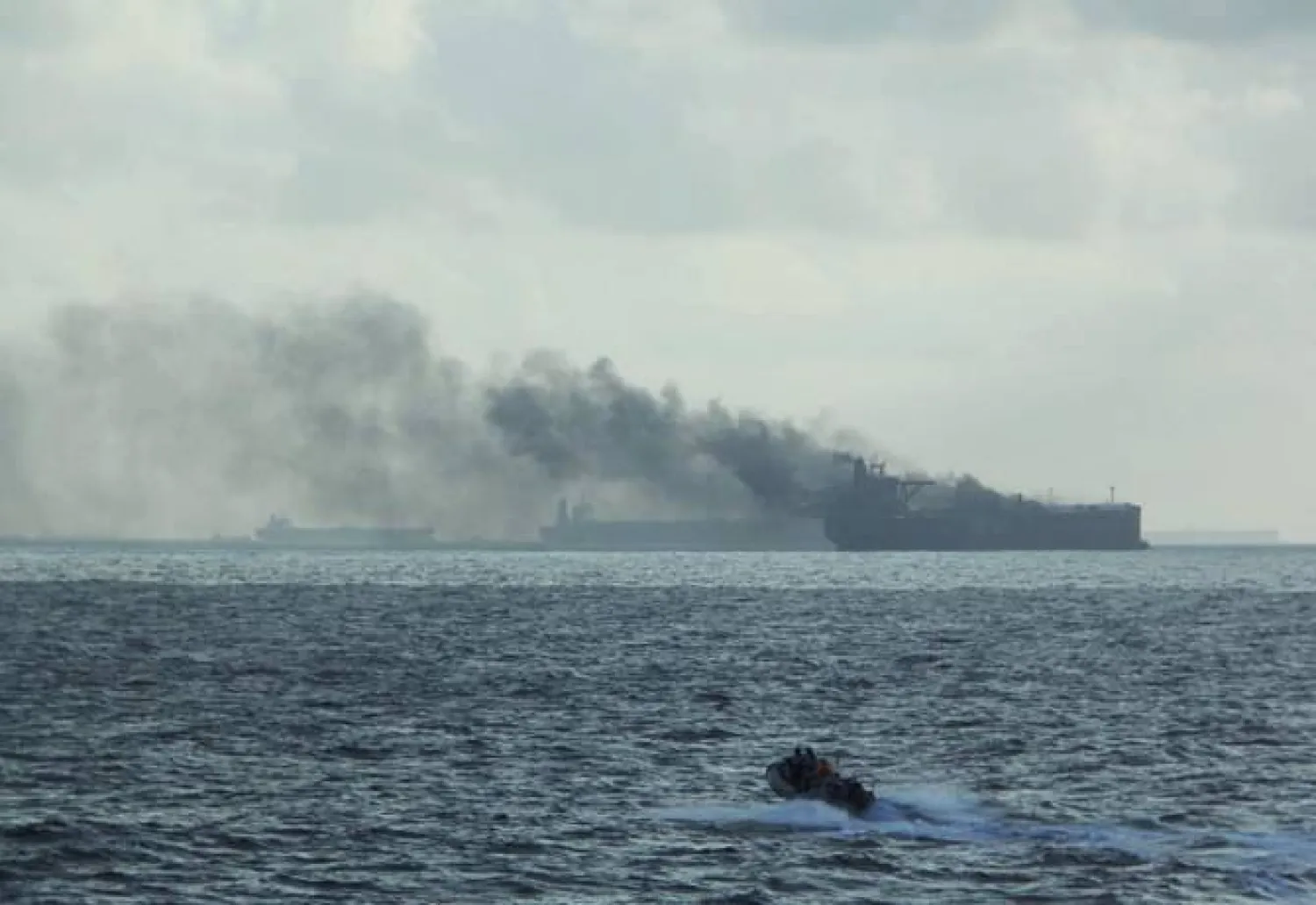 A handout image shows the RSS Supreme’s rigid-hulled inflatable boat in the vicinity of the burning vessels following a fire on two oil tankers about 55km northeast of the Singaporean island of Pedra Branca on July 19, 2024. (Singapore Navy via Reuters)
