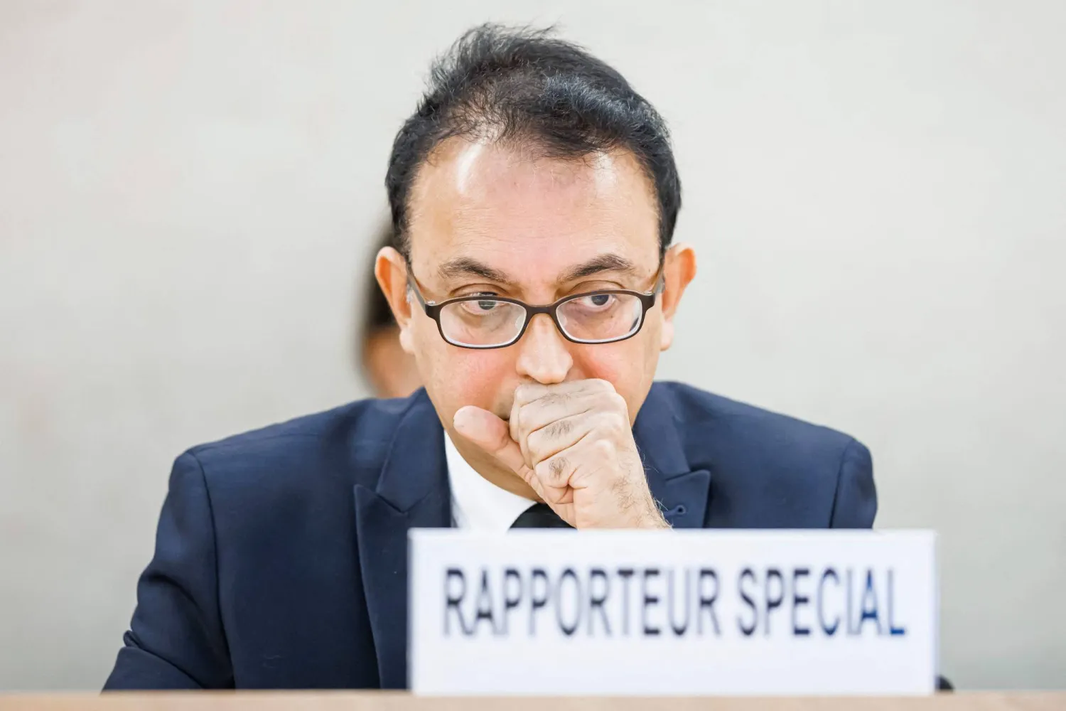 (FILES) Special Rapporteur on the Situation of Human Rights in Iran Javaid Rehman listens to a statement during a special session of the UN Human Rights Council on the situation in Iran, at the United Nations in Geneva on November 24, 2022. (Photo by VALENTIN FLAURAUD / AFP)