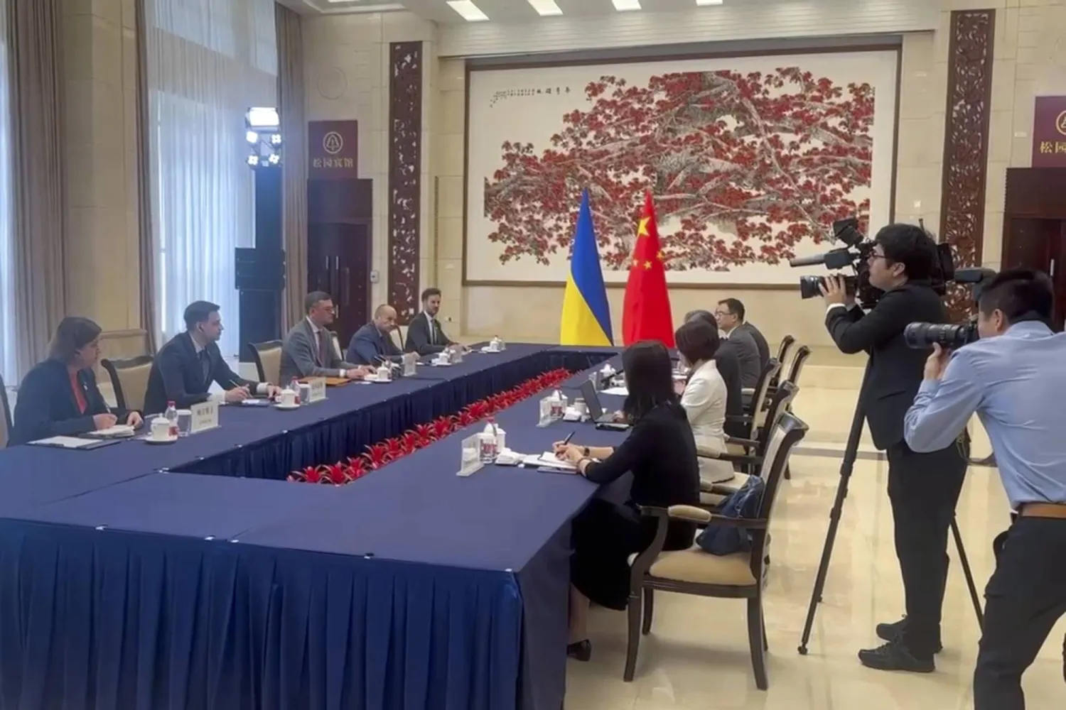 In this image taken from video released by the Ukraine Ministry of Foreign Affairs, Ukraine's Foreign Ministry Dmytro Kuleba, third from left holds talks with China's Foreign Minister Wang Yi at a meeting in the southern Chinese city of Guangzhou on Wednesday, July 24, 2024. (Ukraine's Ministry of Foreign Affairs via AP)