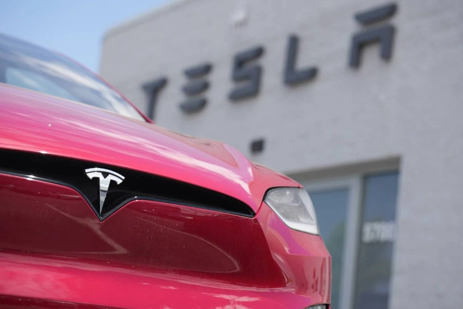 FILE - A Model X sports-utility vehicle sits outside a Tesla store in Littleton, Colo., on June 18, 2023. (AP Photo/David Zalubowski, File)
