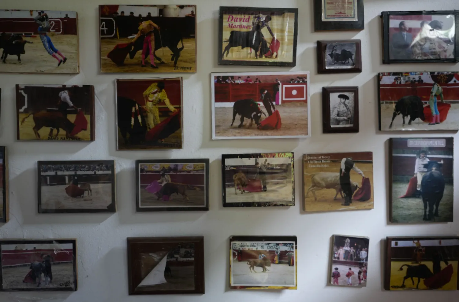 Photos of bullfighters decorate the walls of the bullring in Choachi, Colombia, Saturday, June 22, 2024. (AP Photo/Fernando Vergara)

