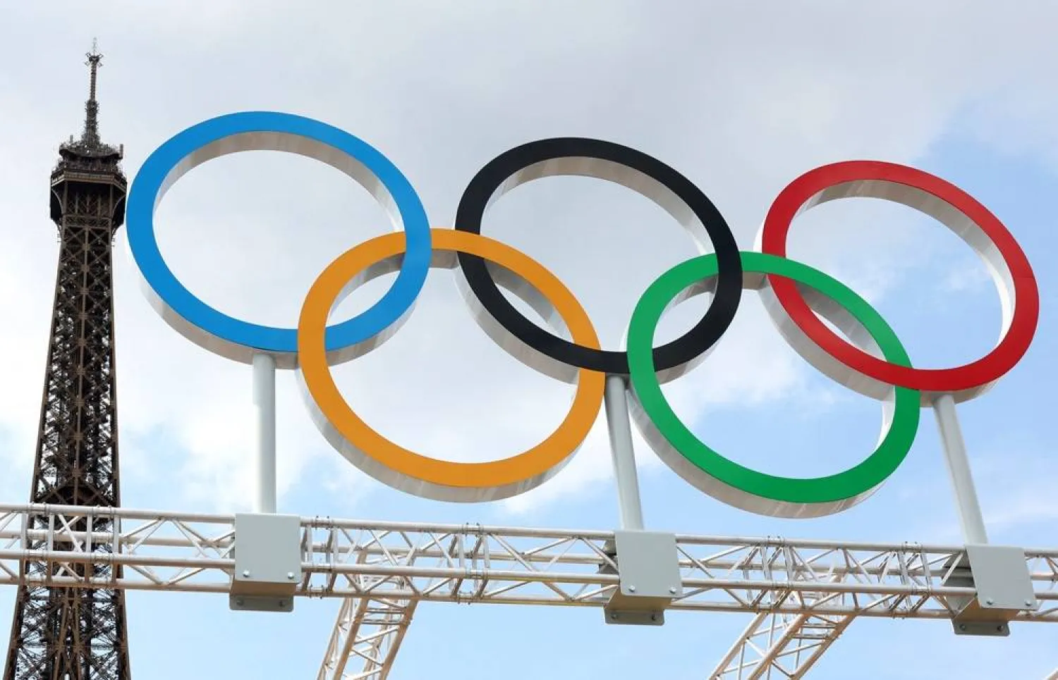  Paris 2024 Olympics - Beach Volleyball Training - Eiffel Tower Stadium, Paris, France - July 24, 2024. General view as the Olympic Rings and the Eiffel Tower are seen during training. (Reuters)