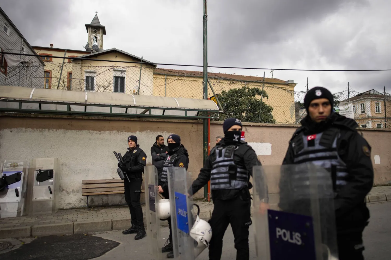 Turkish police officers stand guard in a cordoned off area outside the Santa Maria church, in Istanbul, Türkiye, Sunday, Jan. 28, 2024. (AP Photo/Emrah Gurel)