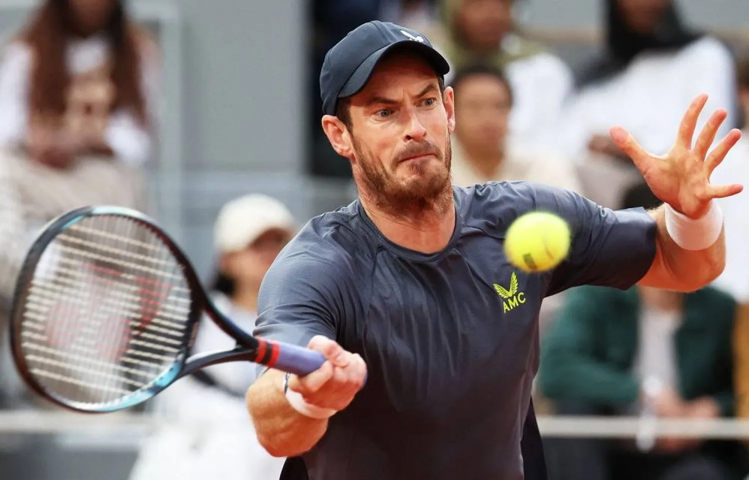 Britain's Andy Murray plays a forehand return to Switzerland's Stan Wawrinka during their men's singles match on day one of the French Open tennis tournament on Court Philippe-Chatrier at The Roland Garros Complex in Paris on May 26, 2024. (AFP)