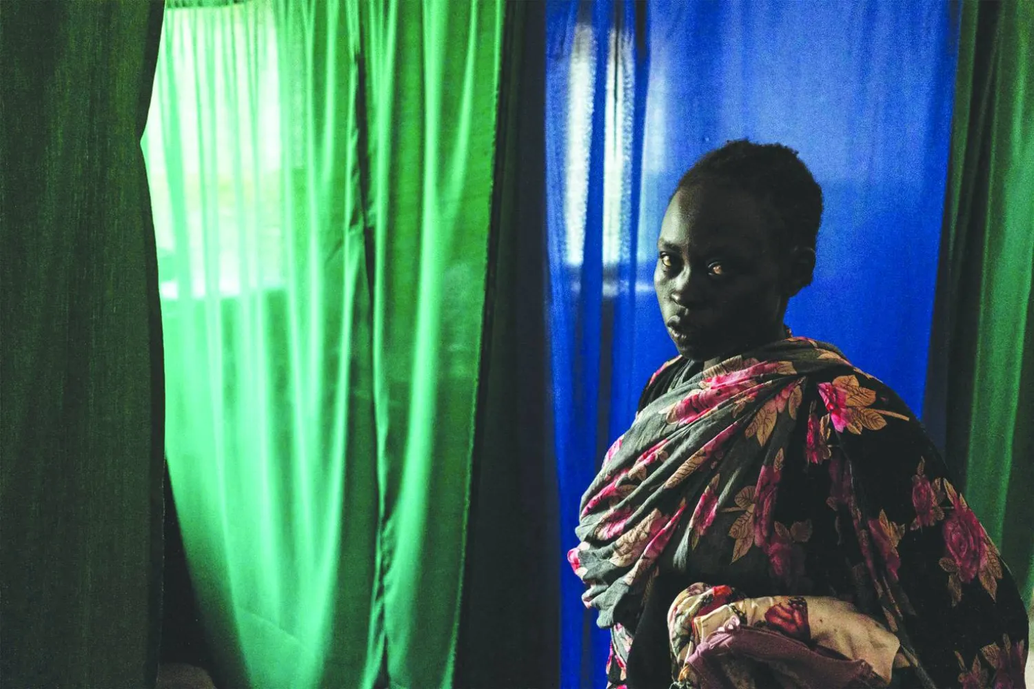 سودانية داخل مستشفى بمنطقة جبال النوبة في السودان (أ.ف.ب)