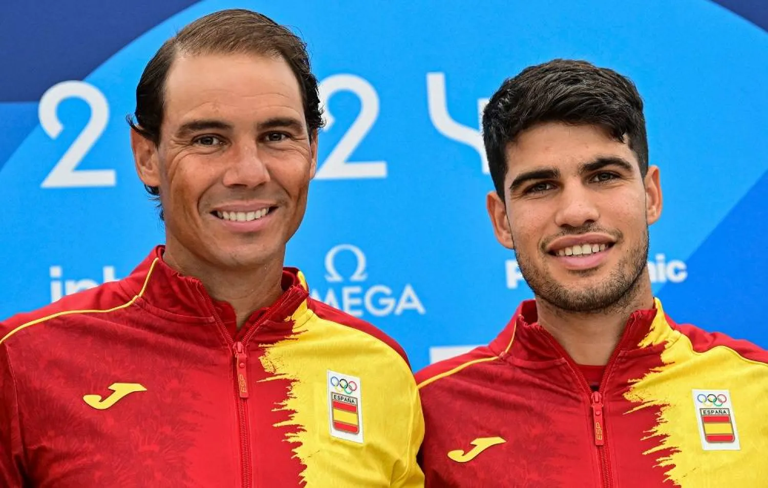 Spain's Rafael Nadal (L) and Spain's Carlos Alcaraz pose for pictures during a press conference at the Olympic Village, in Paris, on July 24, 2024, prior to take part in the men's singles tennis competition of the Paris 2024 Olympic Games. (AFP)