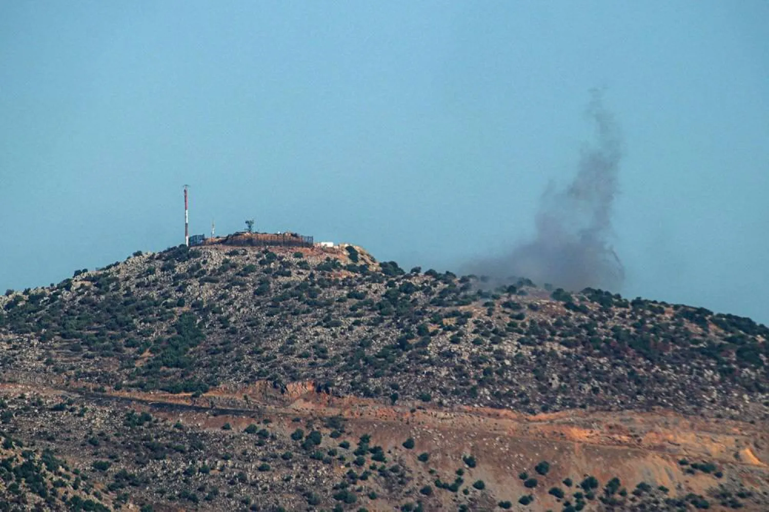 Smoke billows from a site targeted by Lebanon's Hezbollah, along the northern Israeli border with Lebanon on July 25, 2024, amid ongoing cross-border clashes between Israeli troops and Hezbollah fighters. (AFP)