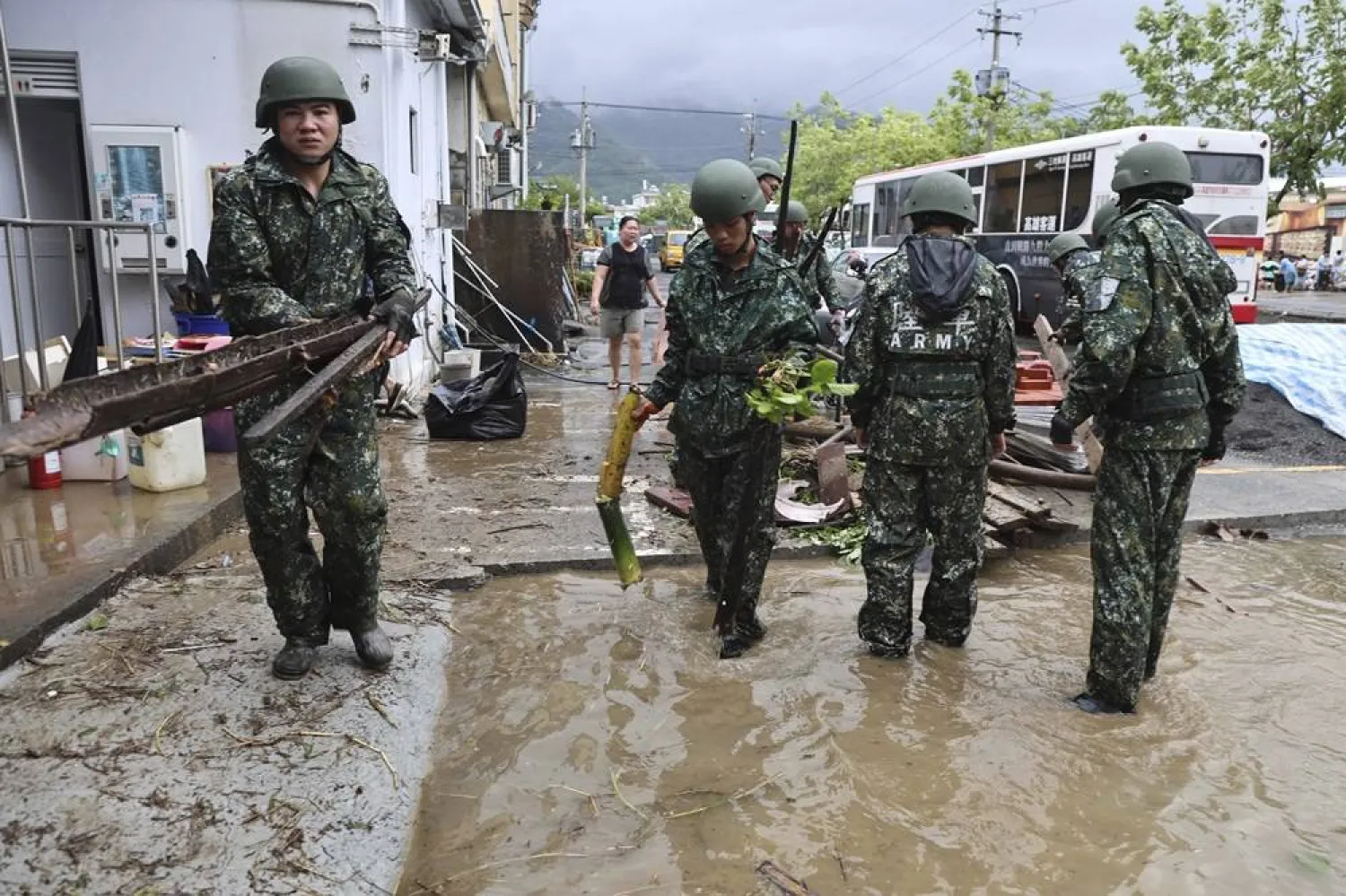  In this photo released by the Taiwan Ministry of National Defense, Taiwanese soldiers clear debris in the aftermath of Typhoon Gaemi in Kaohsiung county in southwestern Taiwan, Friday, July 26, 2024. (Taiwan Ministry of National Defense via AP) 