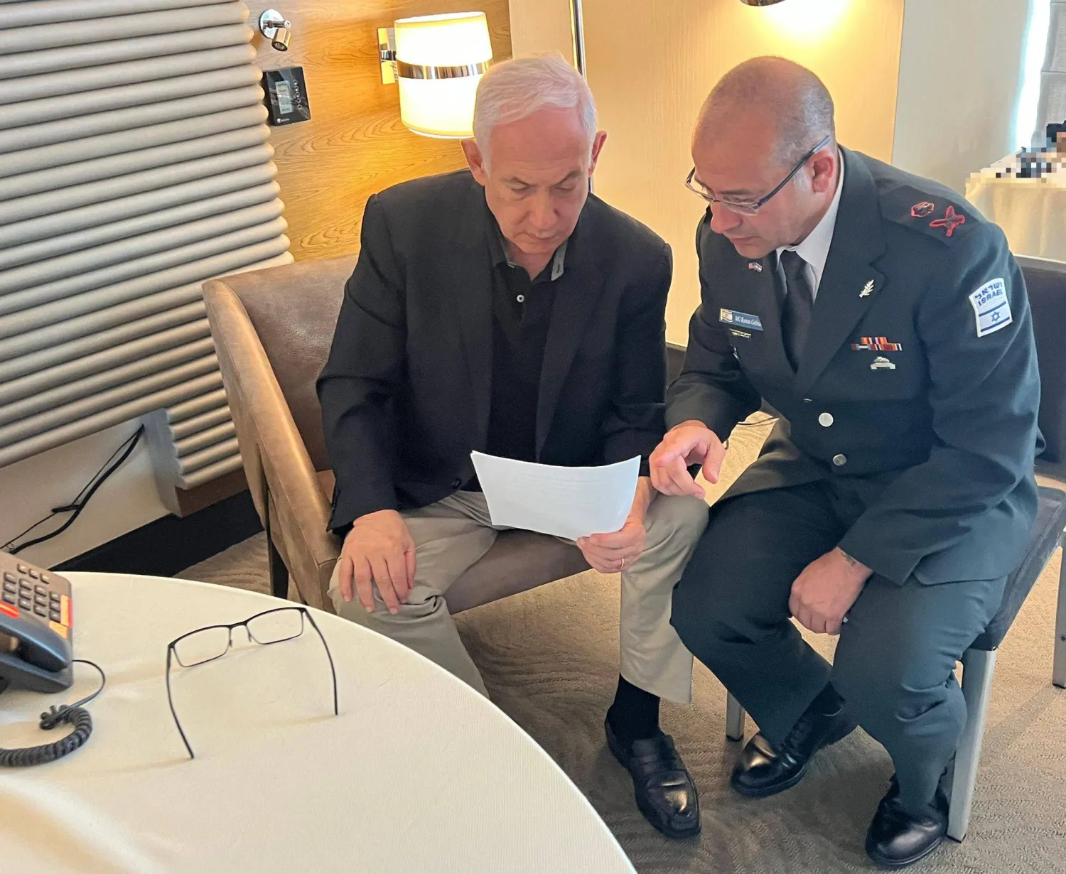 HANDOUT - 27 July 2024, US: Israeli Prime Minister Benjamin Netanyahu (L) holds a preliminary consultation with his Military Secretary, Maj. Gen. Roman Gofman, in the wake of the attack. Photo: Amos Ben-Gershom/GPO/dpa 