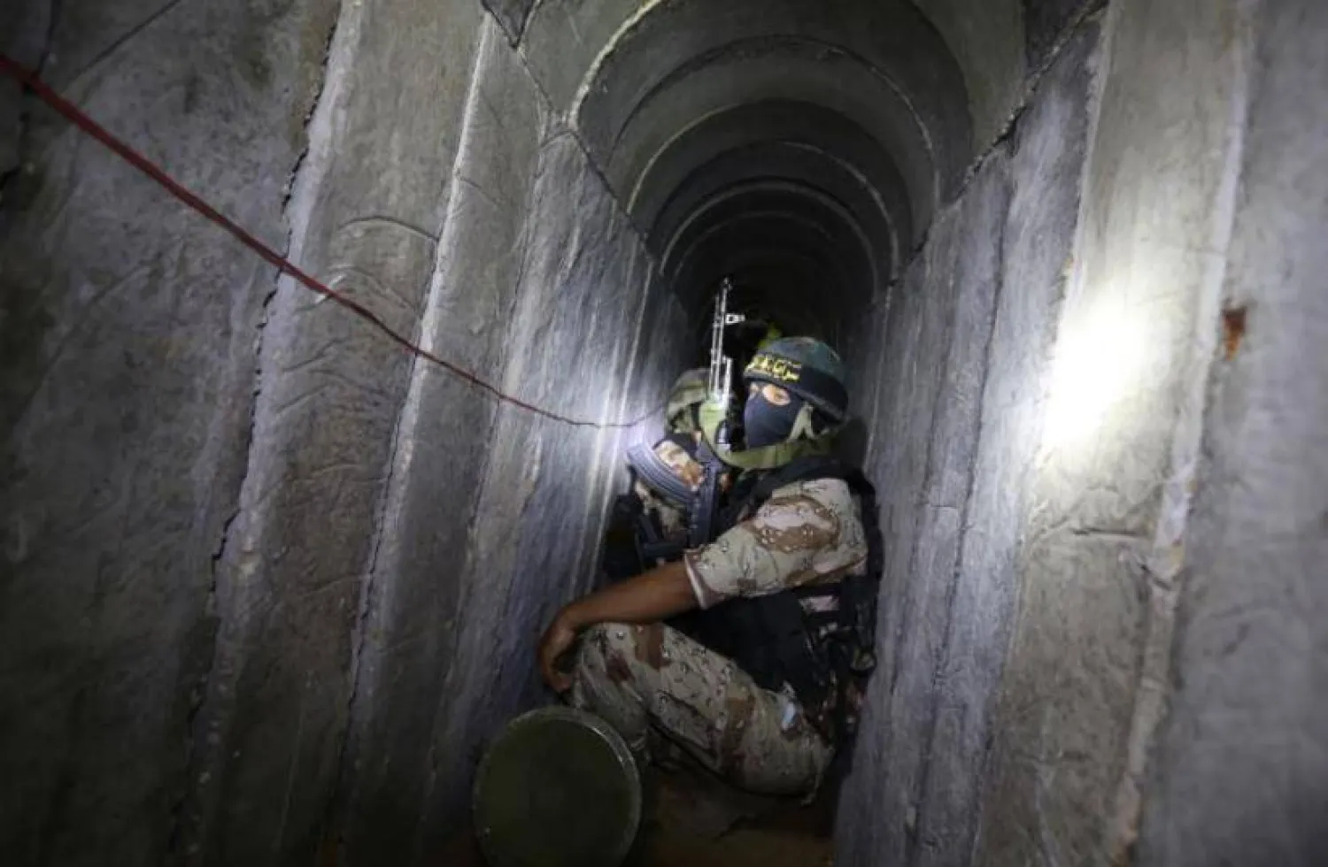 A Palestinian fighter from the Islamic Jihad's armed wing, the Al-Quds Brigades, is seen in a tunnel in the south of the Gaza Strip (AFP)