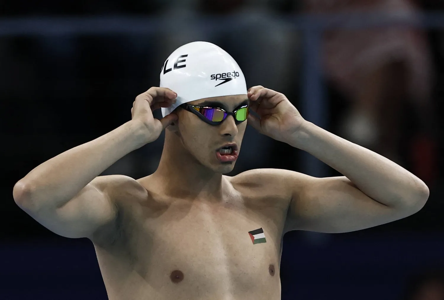 Paris 2024 Olympics - Swimming - Men's 100m Backstroke - Heats - Paris La Defense Arena, Nanterre, France - July 28, 2024. Yazan Al Bawwab of Palestine reacts. REUTERS/Clodagh Kilcoyne Purchase Licensing Rights