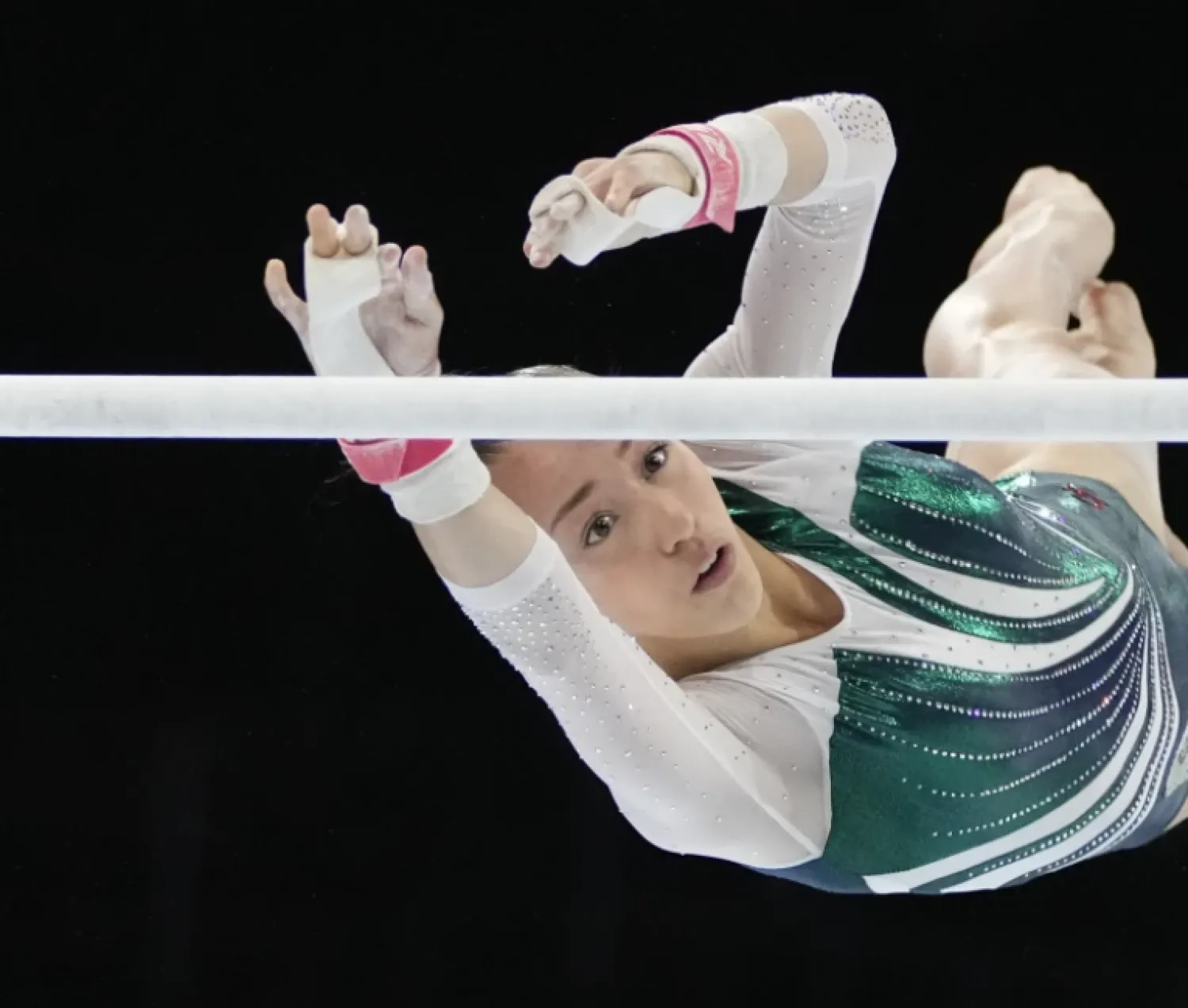 FILE - Algeria’s Kaylia Nemour competes on the uneven bars to win the silver medal during the apparatus finals at the Artistic Gymnastics World Championships in Antwerp, Belgium, Saturday, Oct. 7, 2023. The 17-year-old athlete, one of the best in the world on uneven bars, was born in France. She grew up here, and still trains here. (AP Photo/Virginia Mayo, File)
