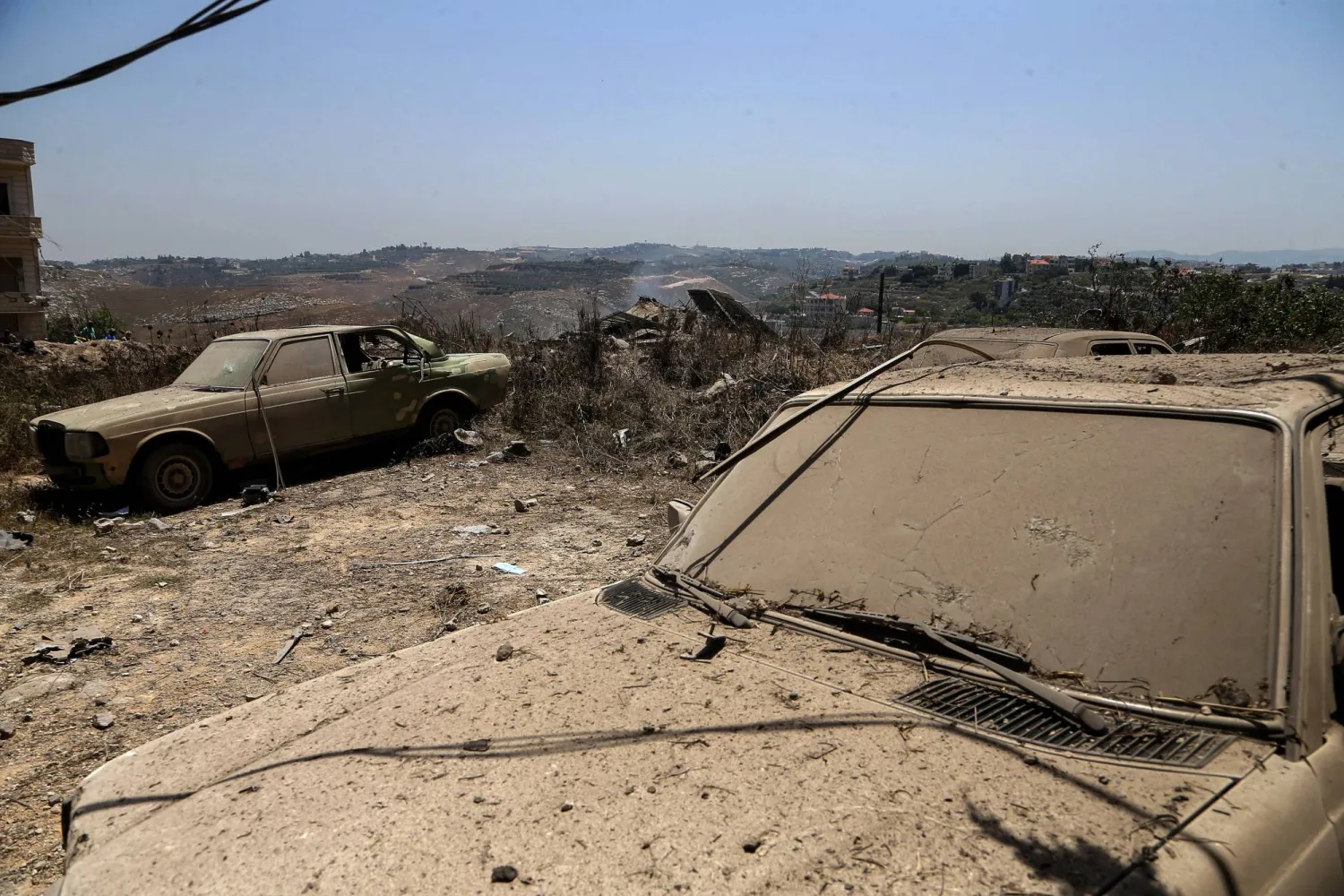 FILED - 14 June 2024, Lebanon, Janta: A view of destroyed cars in front of a Hezbollah three-story building that was demolished in an Israeli overnight air raid in the southern Lebanese village of Janata. Photo: Marwan Naamani/dpa