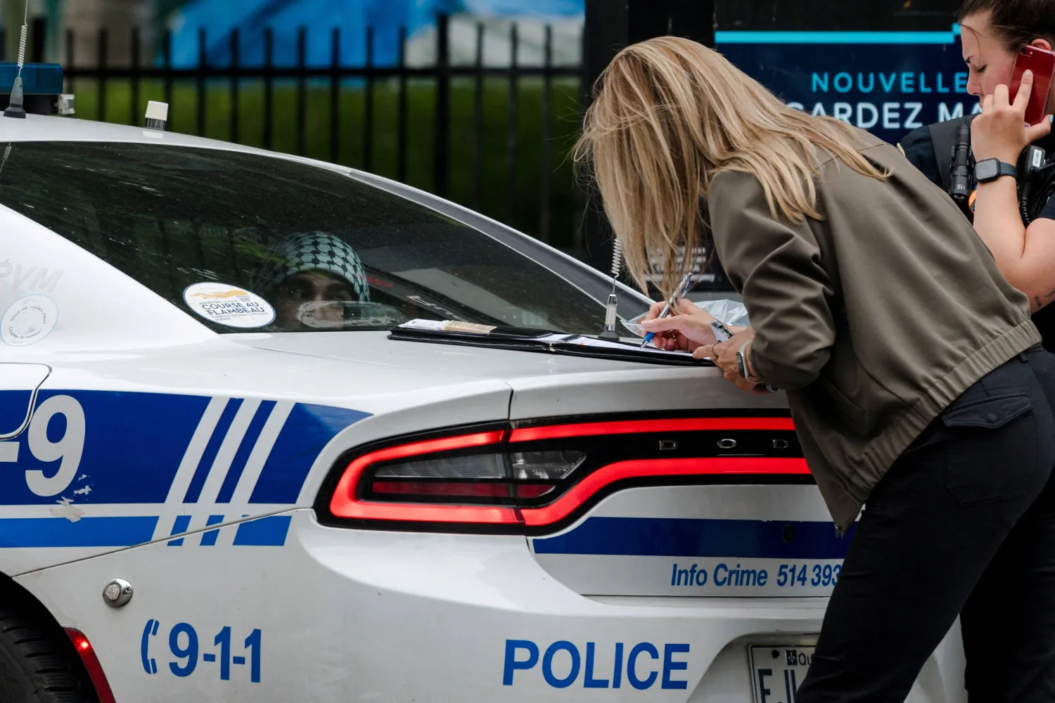 A man is detained as a protest camp in support of Palestinians, assembled during the ongoing conflict between Israel and Hamas, is removed by authorities at McGill University’s campus in Montreal, Quebec, Canada July 10, 2024.  REUTERS/Andrej Ivanov