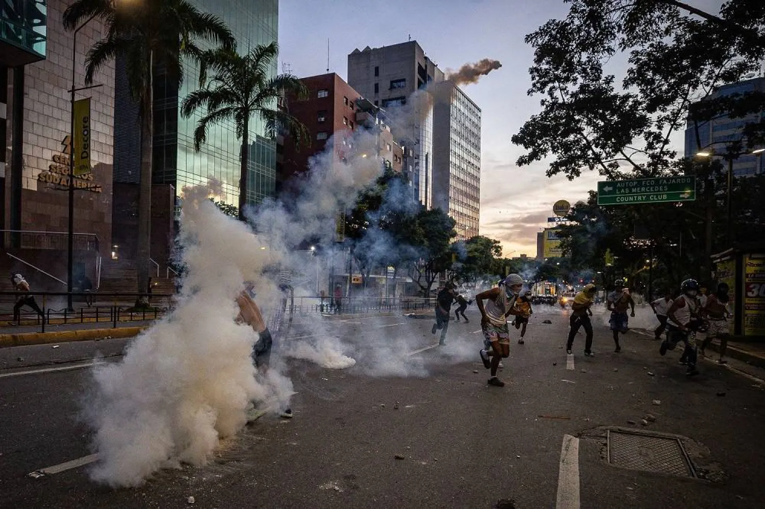 Protesters clash with the Bolivarian National Guard (GNB) over the results of the presidential elections in Caracas, Venezuela, 29 July 2024. (EPA)