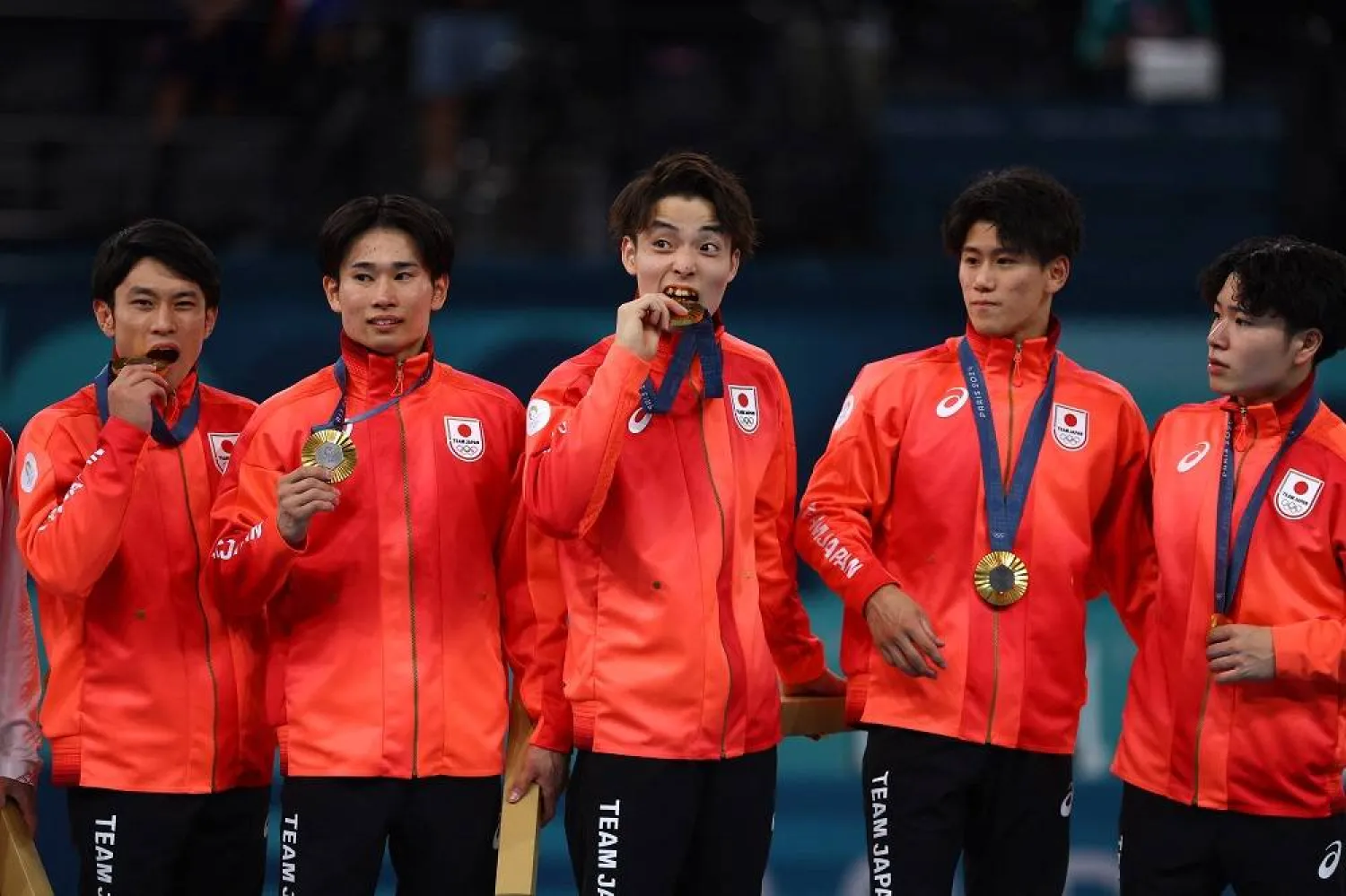 Paris 2024 Olympics - Artistic Gymnastics - Men's Team Victory Ceremony - Bercy Arena, Paris, France - July 29, 2024. Gold medalists Daiki Hashimoto, Kazuma Kaya, Shinnosuke Oka, Takaaki Sugino and Wataru Tanigawa of Japan celebrate on the podium with their medals. (Reuters)