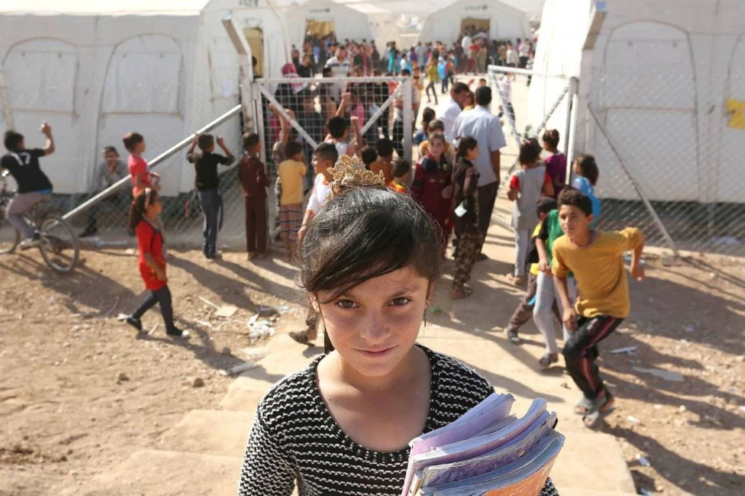 A Yazidi refugee girl from the minority Yazidi sect poses for a photograph on the first day of the new school term at Sharya refugee camp, on the outskirts of Duhok province in Iraq last October. (STRINGER/IRAQ / REUTERS)

