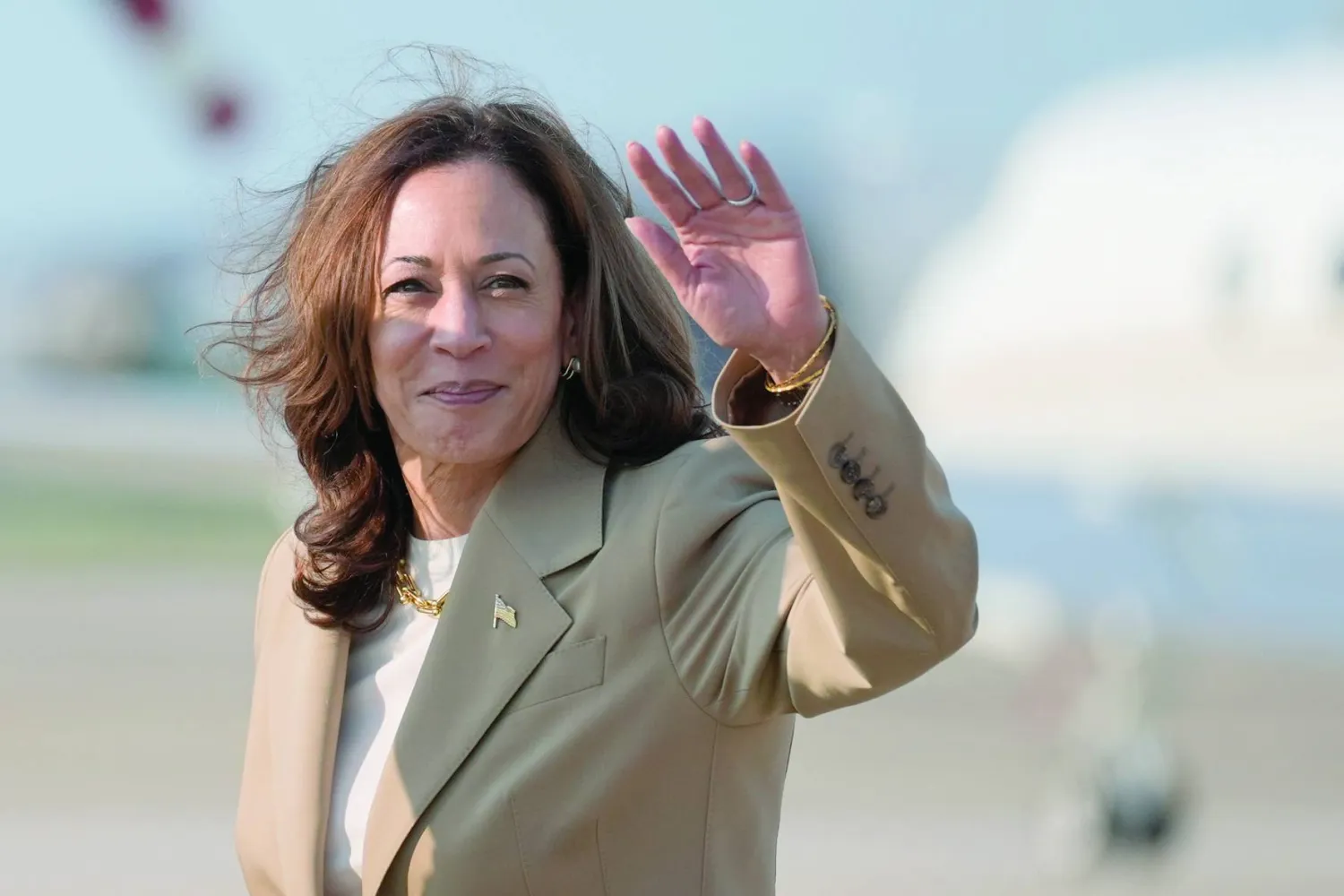 Vice President Kamala Harris waves upon arrival at Andrews Air Force Base in Md., Saturday, July 27, 2024. (AP Photo/Stephanie Scarbrough, Pool)