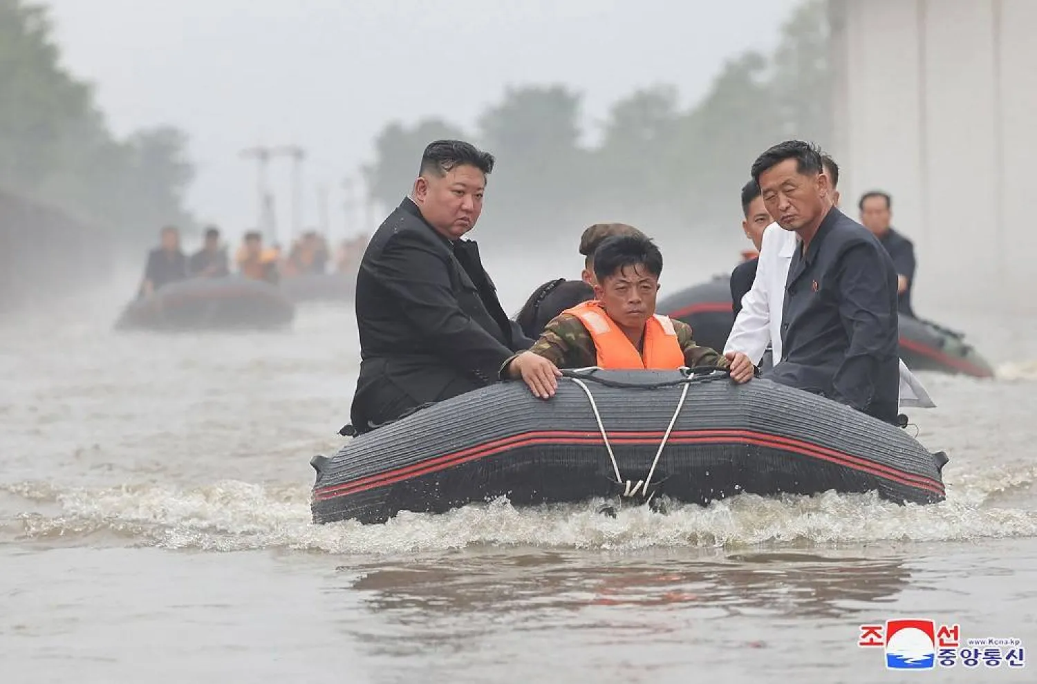  This recent undated photo released by North Korea's official Korean Central News Agency (KCNA) via KNS on July 31, 2024 shows North Korea's leader Kim Jong Un (L) riding in a dingy through flood waters as he inspects the area for damage after record-breaking heavy rains on July 29 in the city of Sinuiju in North Pyongan Province. (Photo by KCNA VIA KNS / AFP)