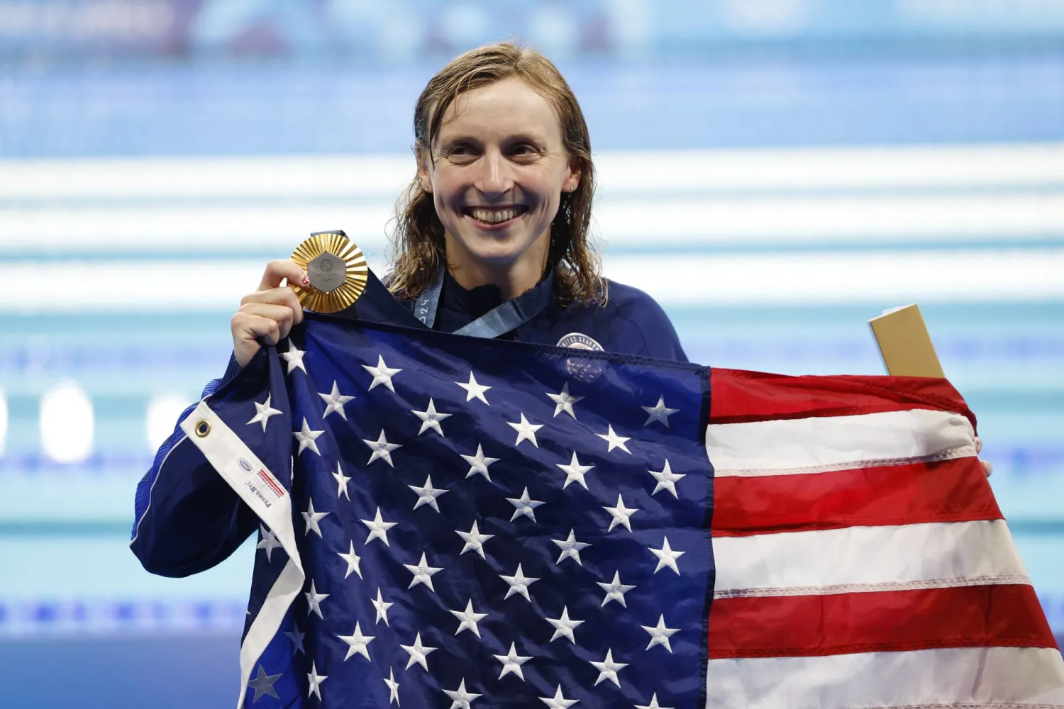 كاتي ليديكي مقلدة بذهبية سبقا الـ 1500 متر سباحة حرة ضمن منافسات الألعاب الأولمبية (إ.ب.أ)