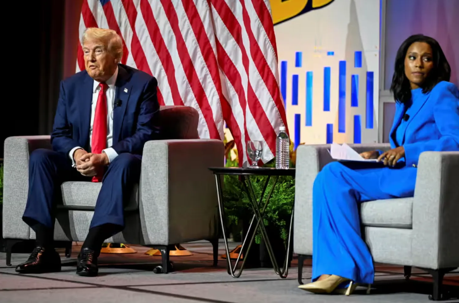 Donald Trump speaks at an NABJ panel beside Rachel Scott of ABC News, in Chicago, Illinois, on 31 July 2024. Photograph: Vincent Alban/Reuters

